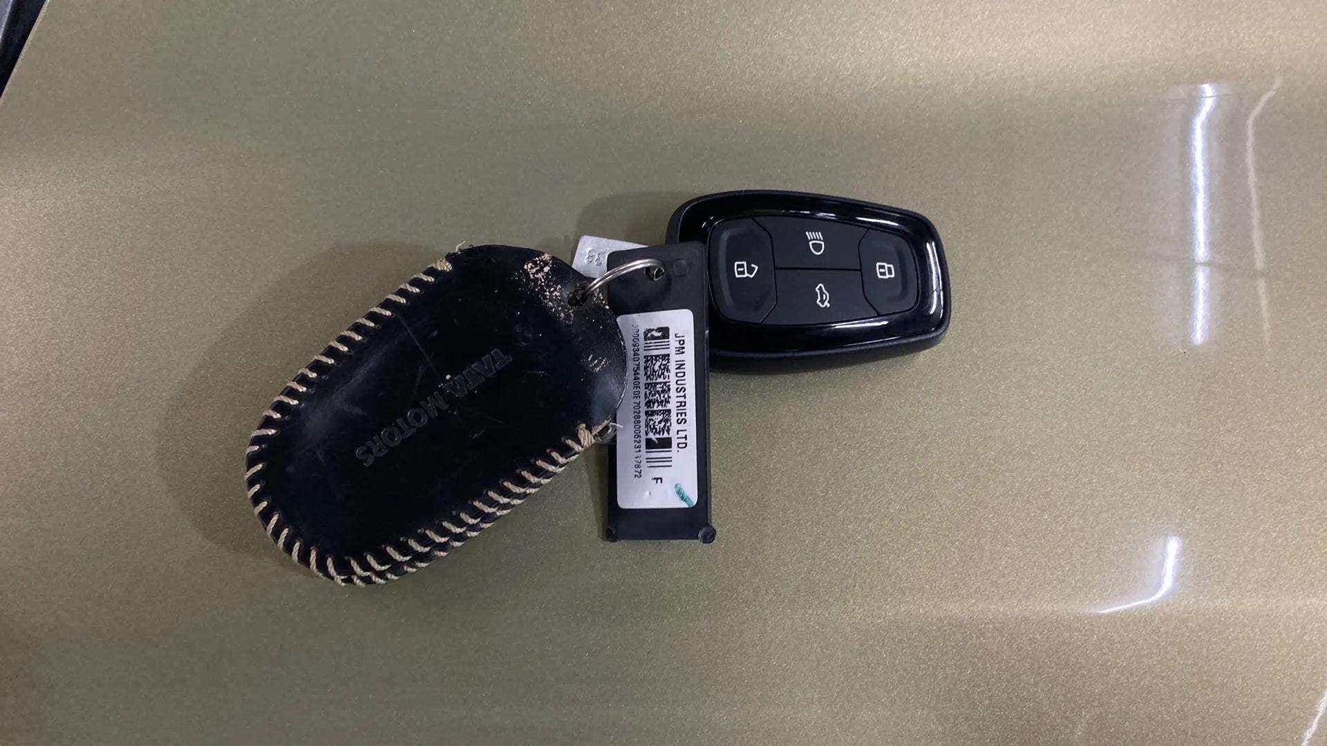 Car key fob on the hood of a Tata Nexon 2017-2023