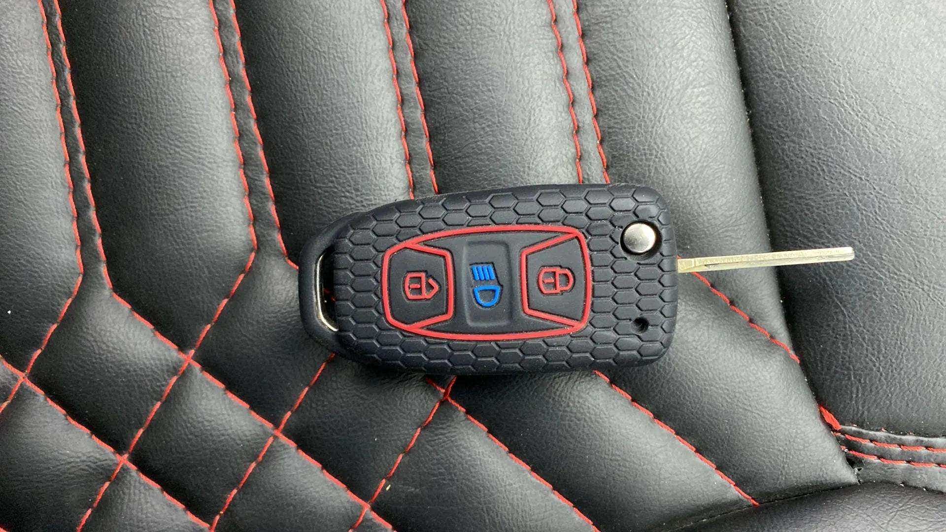 Car key fob on a leather seat of a Tata Nexon