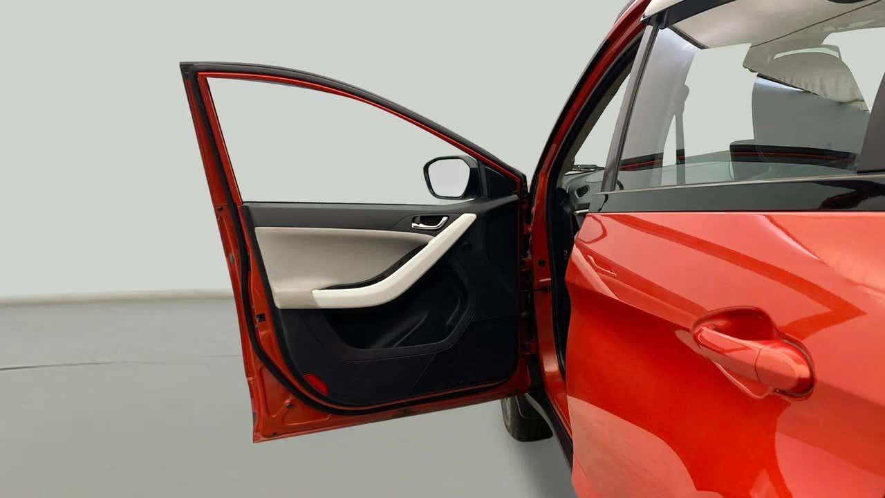 Driver side door open view of a Tata Nexon