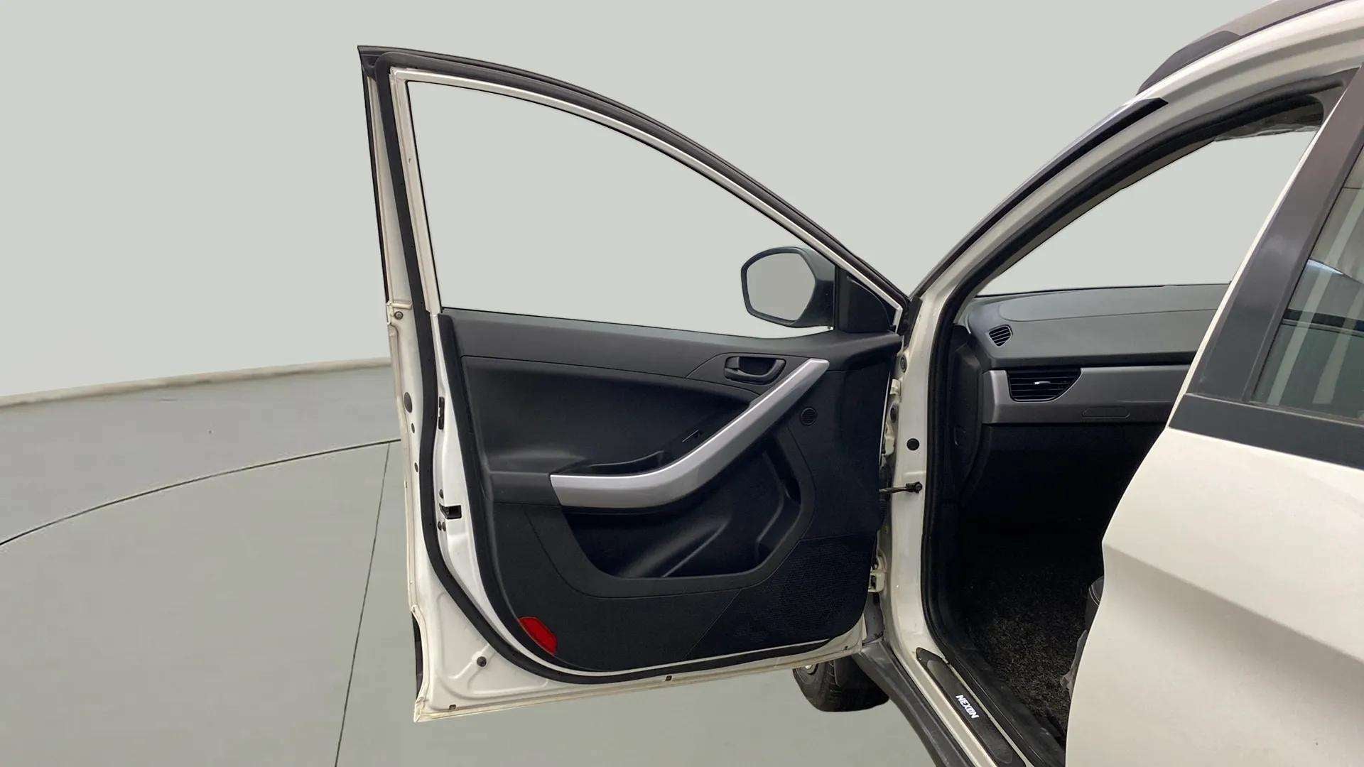 Front driver side door and interior view of a Tata Nexon 2017-2023