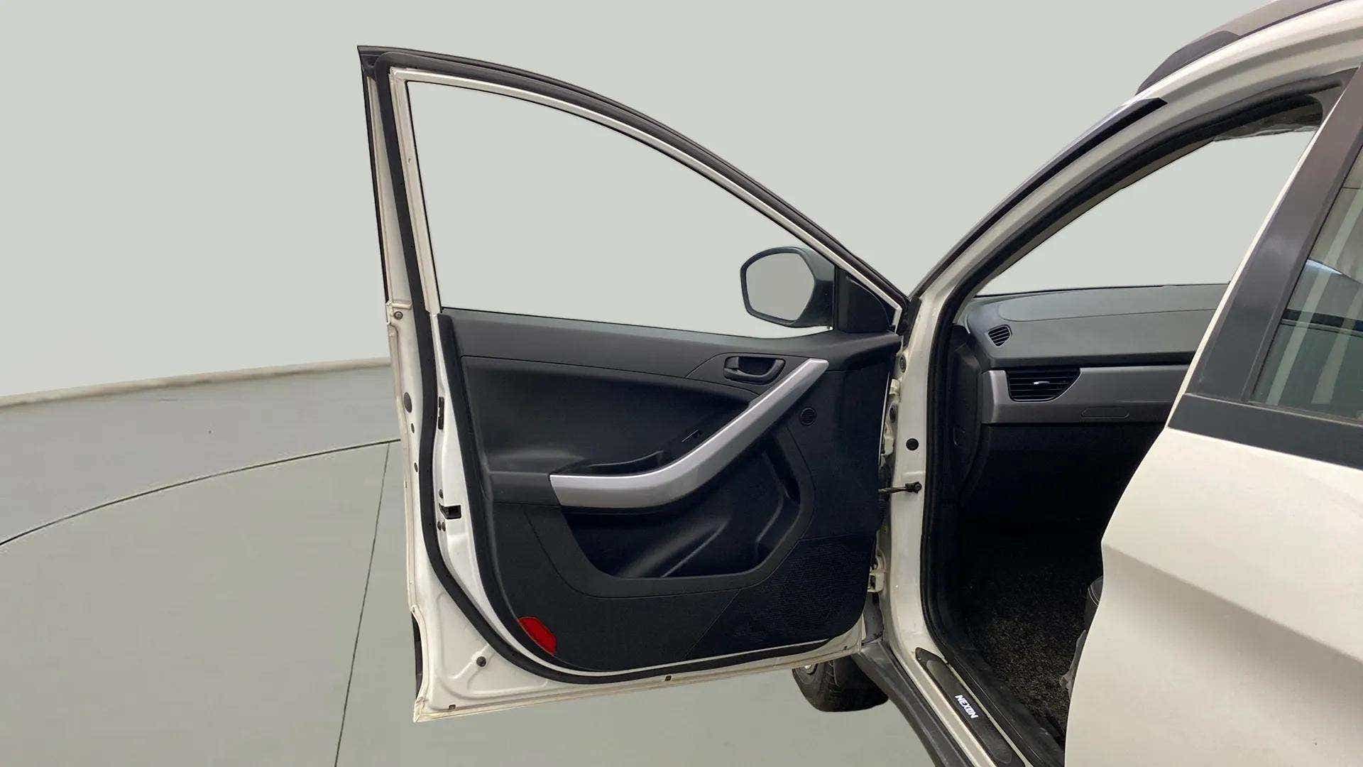 Front driver side door and interior view of a Tata Nexon 2017-2023