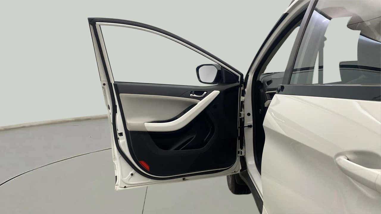 Front left door open view of a Tata Nexon