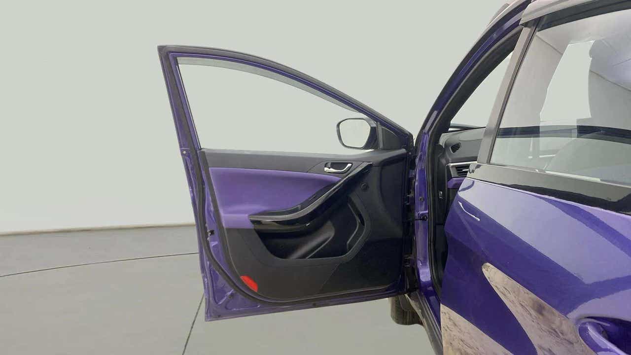 Open front driver side door of a Tata Nexon