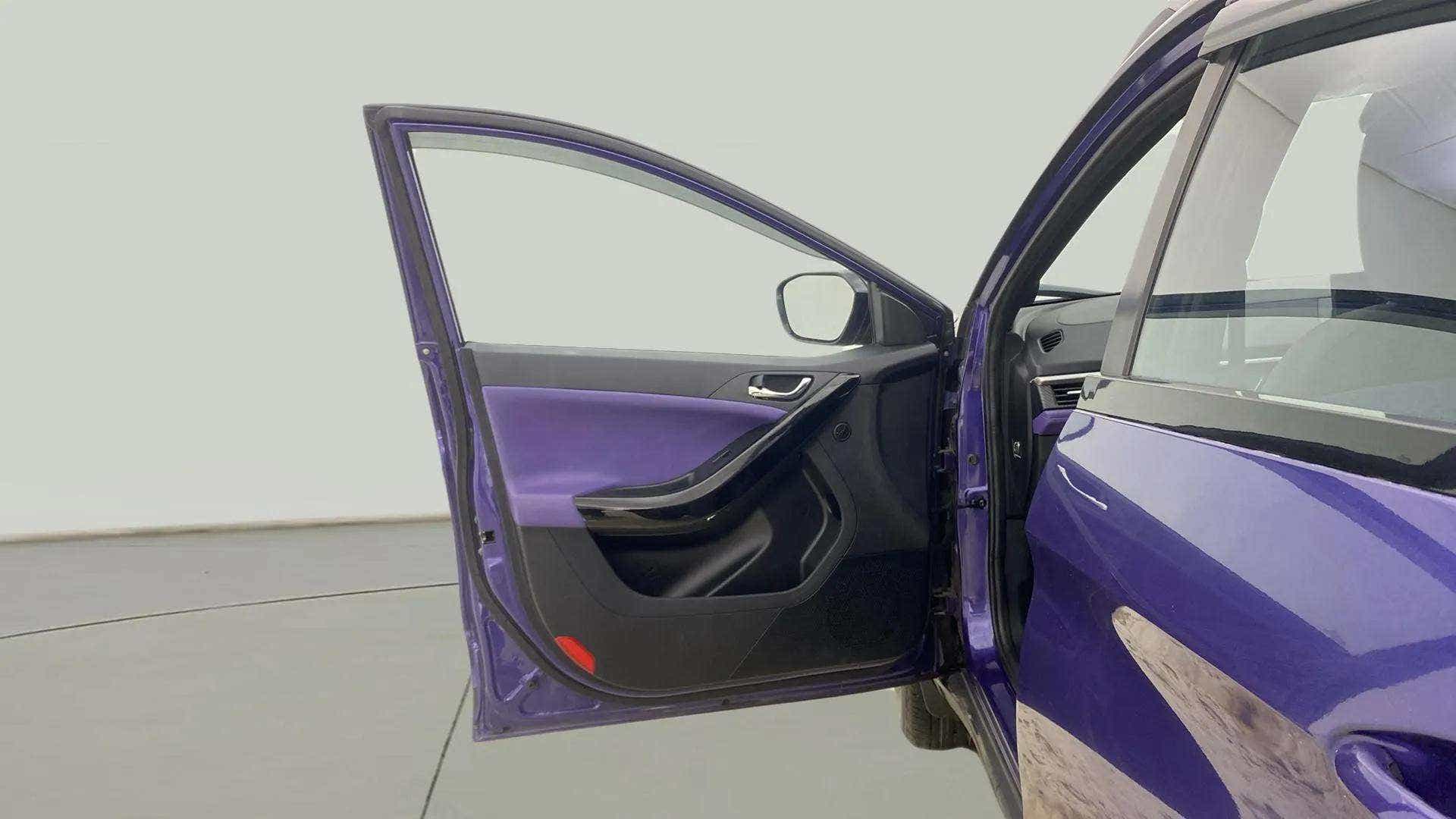 Open front driver side door of a Tata Nexon