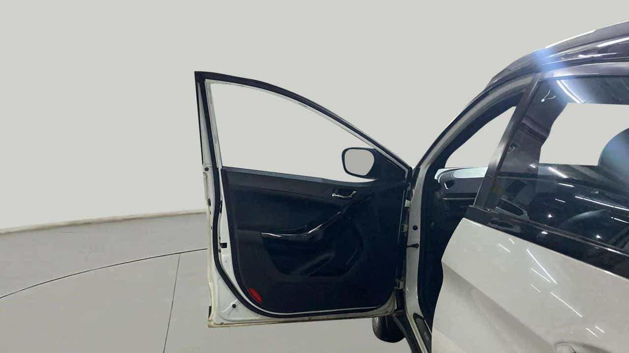 Open front driver-side door of a Tata Nexon 2017-2023