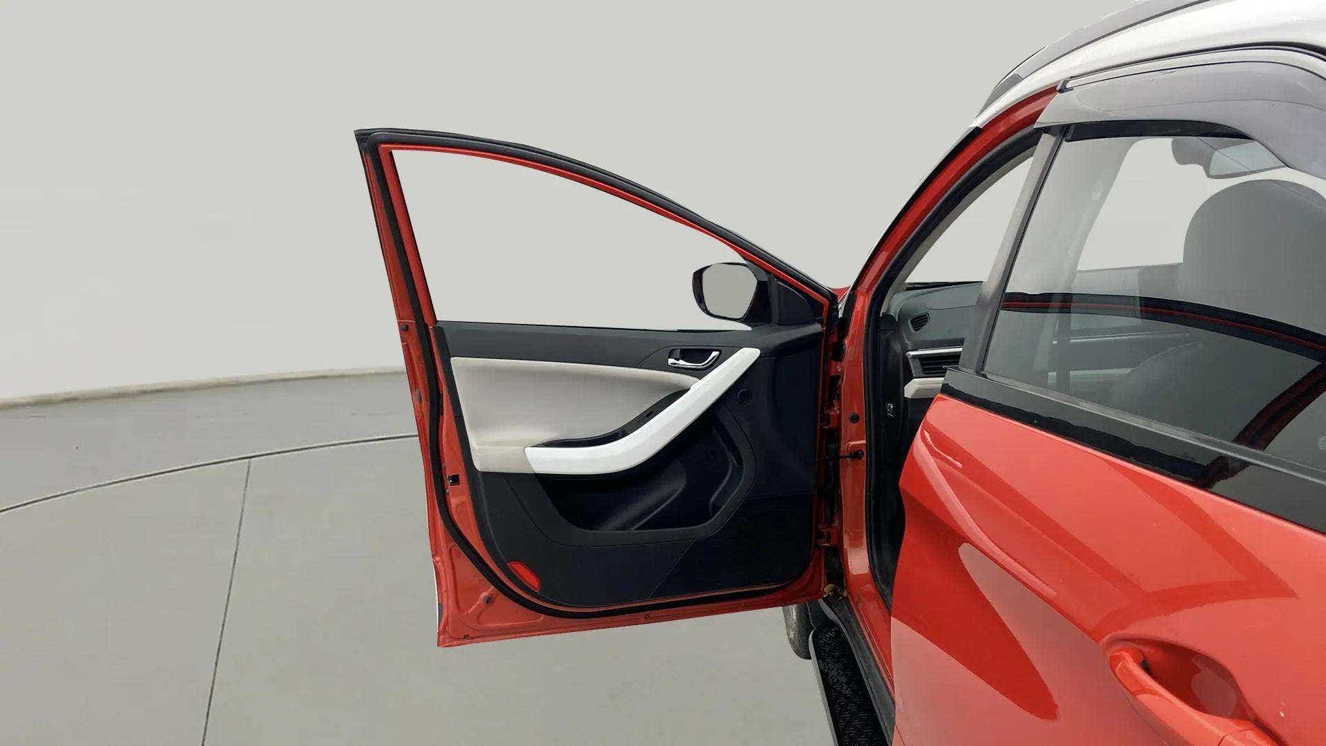 Front left door open view of a Tata Nexon