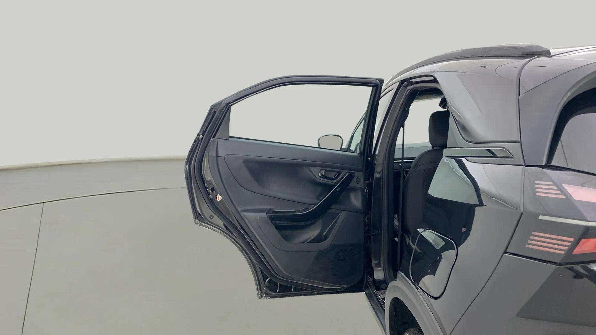 Rear left door open view of a Tata Nexon