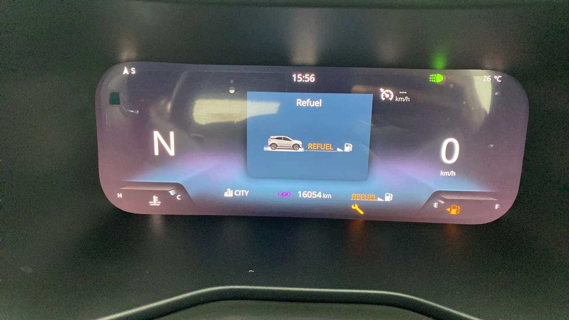 Instrument cluster display of a Tata Nexon 2017-2023 showing refuel warning