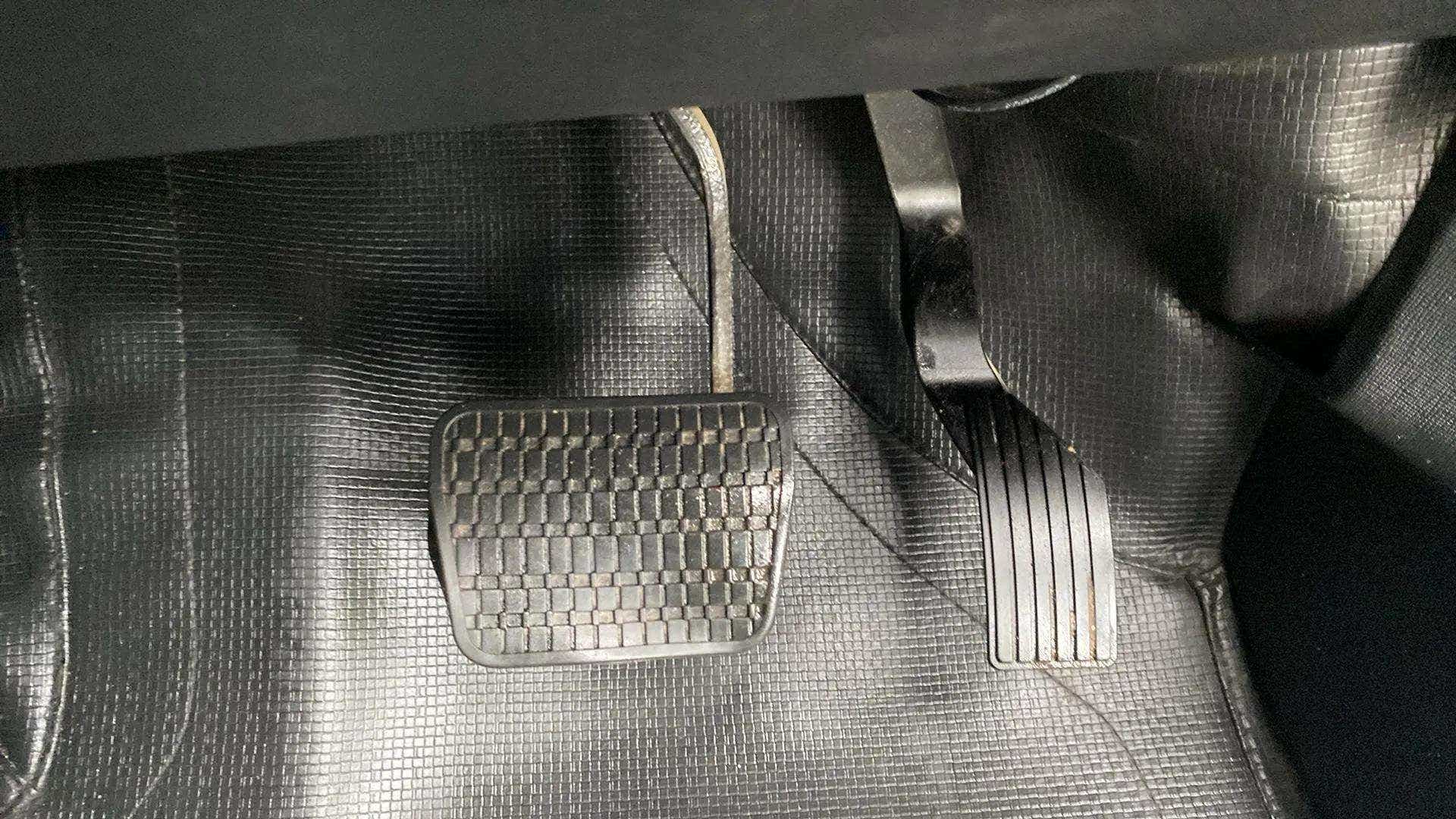 Close-up of foot pedals of a Tata Nexon