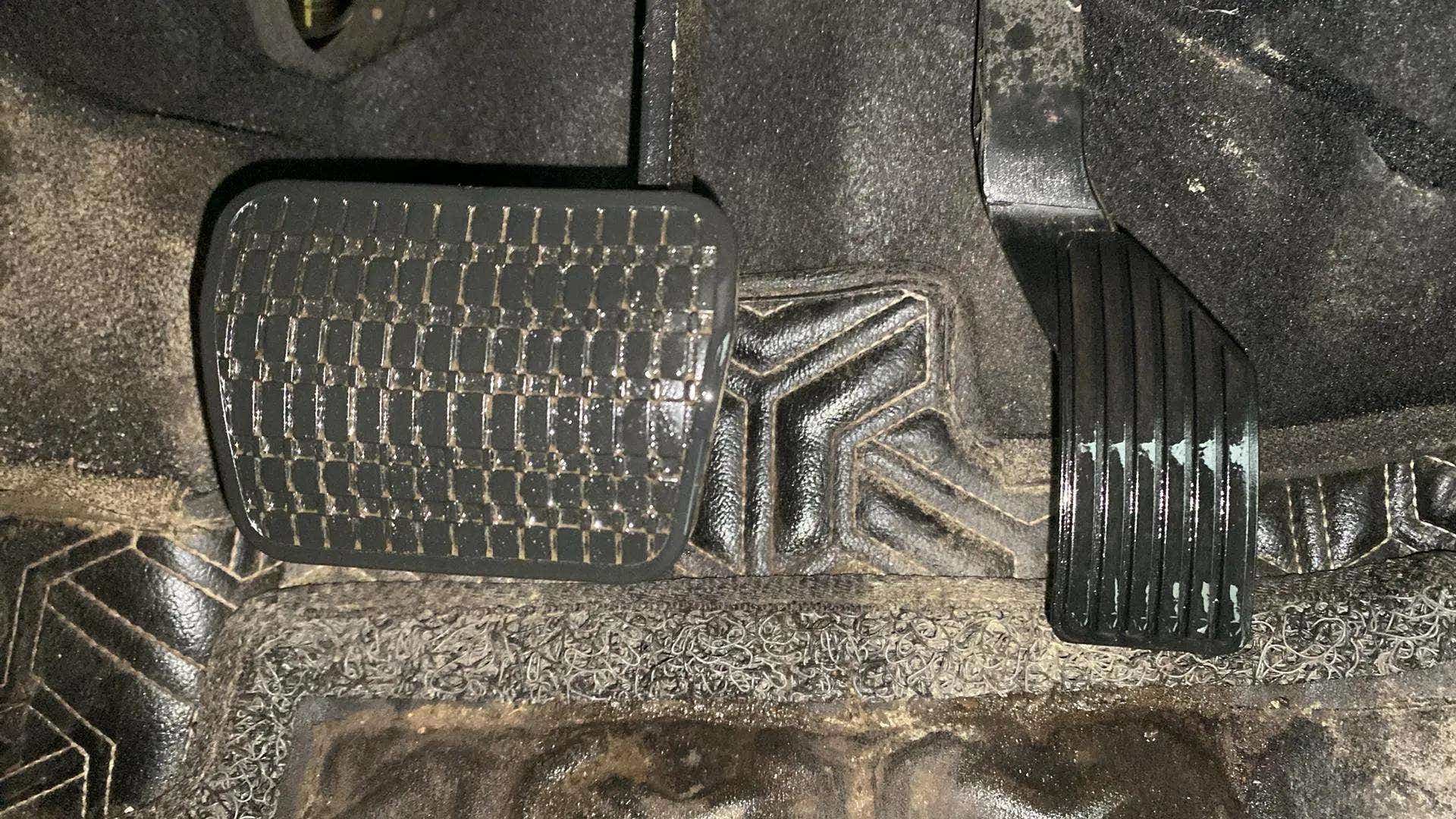 Footwell close-up showing pedals of a Tata Nexon