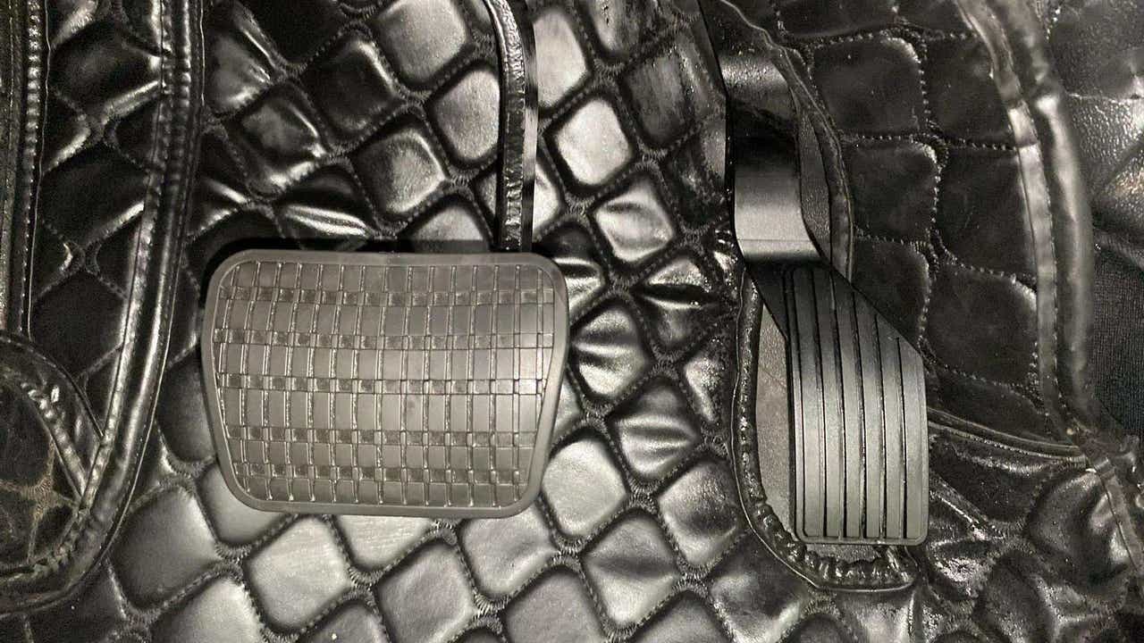 Close-up of foot pedals of a Tata Nexon