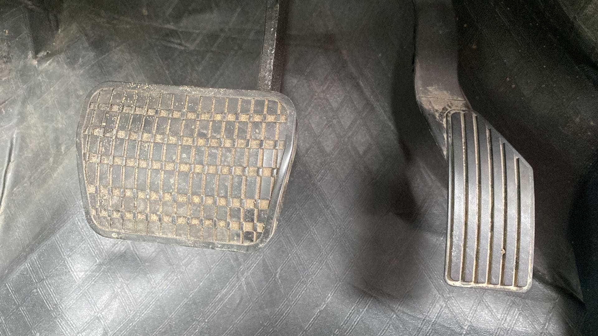 Close-up of foot pedals of a Tata Nexon 2017-2023