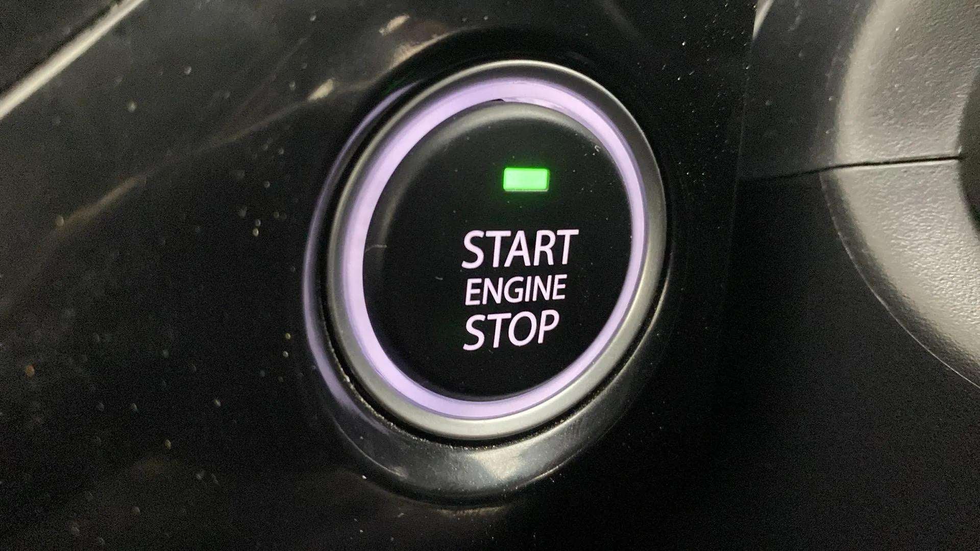 Close-up of a start engine stop button in a Tata Nexon 2017-2023
