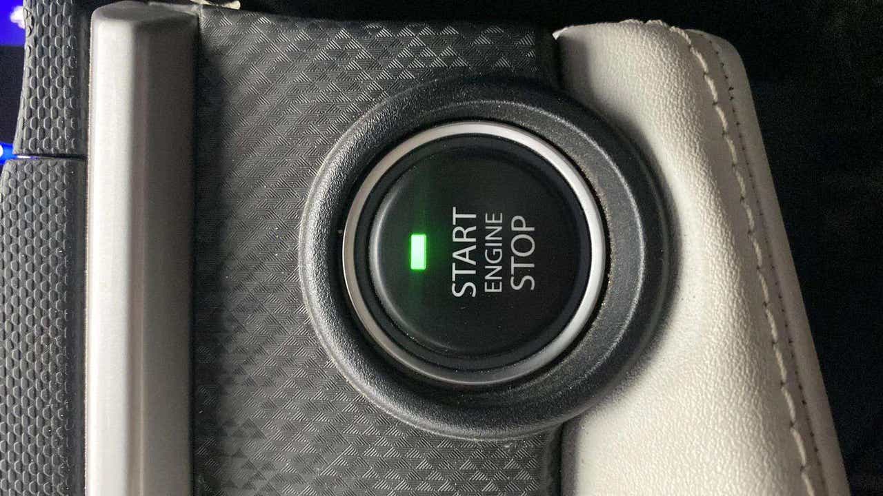Close-up of start engine stop button of a Tata Nexon
