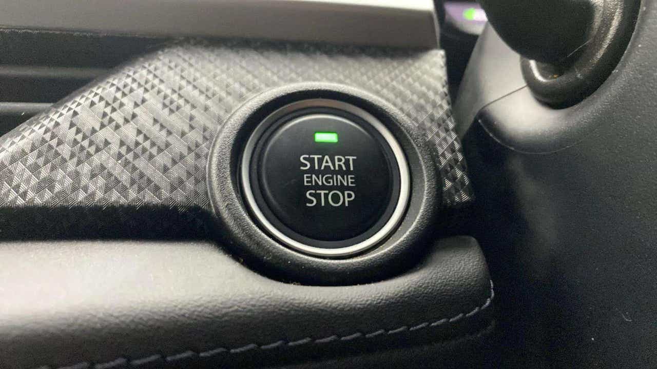 Close-up of the engine start stop button of a Tata Nexon