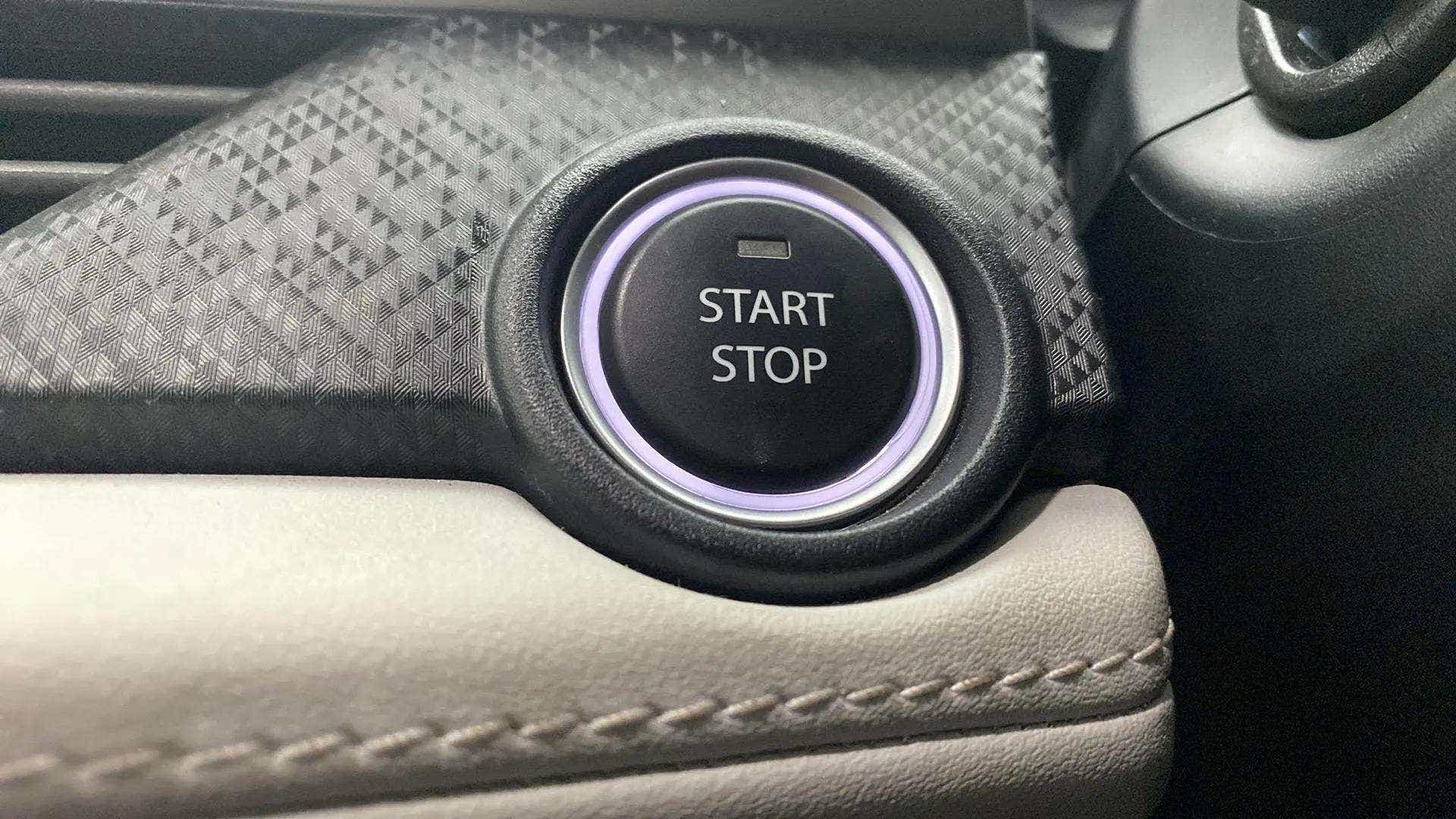 Close-up of the start stop button in a Tata Nexon