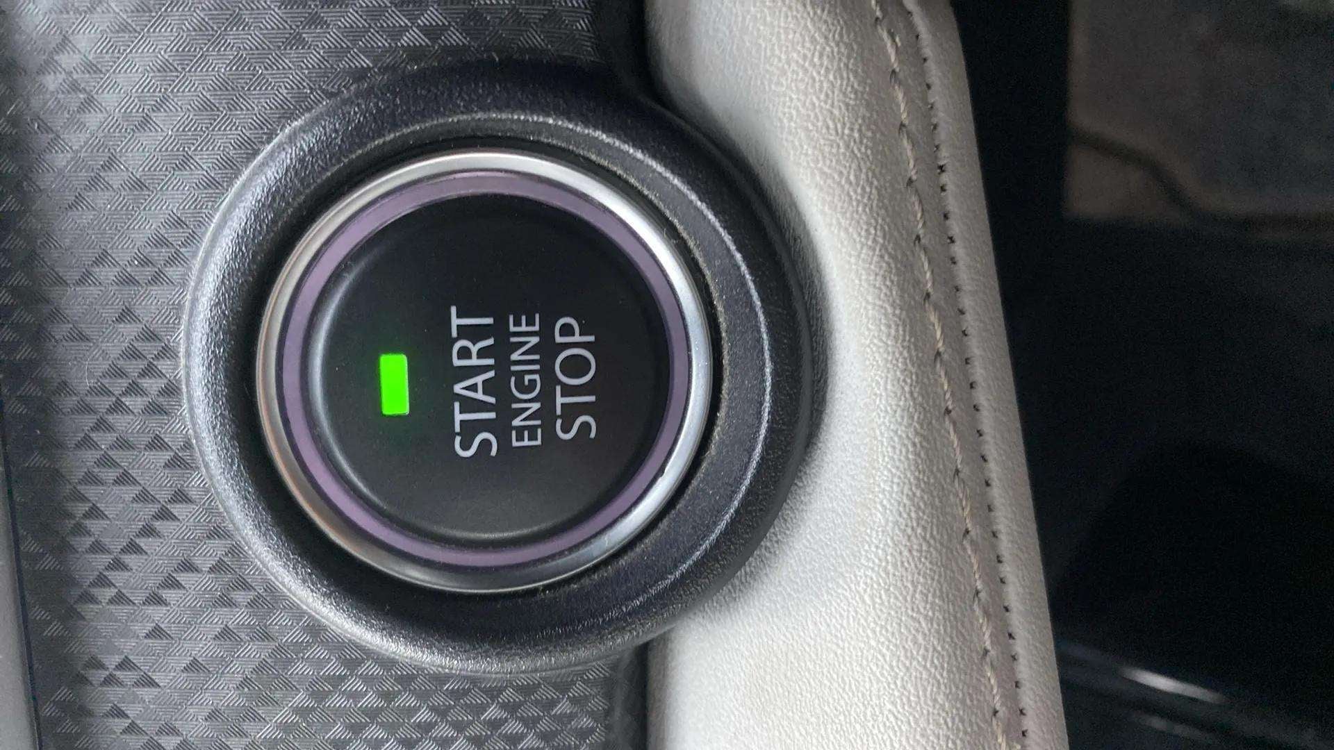 Close-up of the engine start stop button of a Tata Nexon