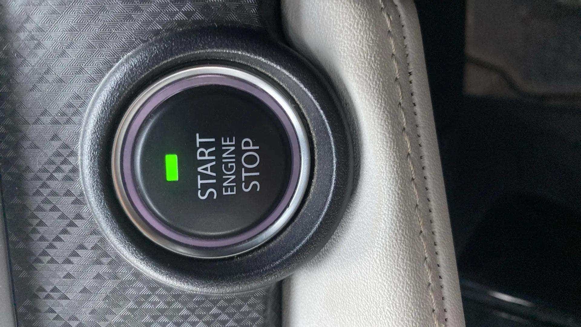 Close-up of the engine start stop button of a Tata Nexon
