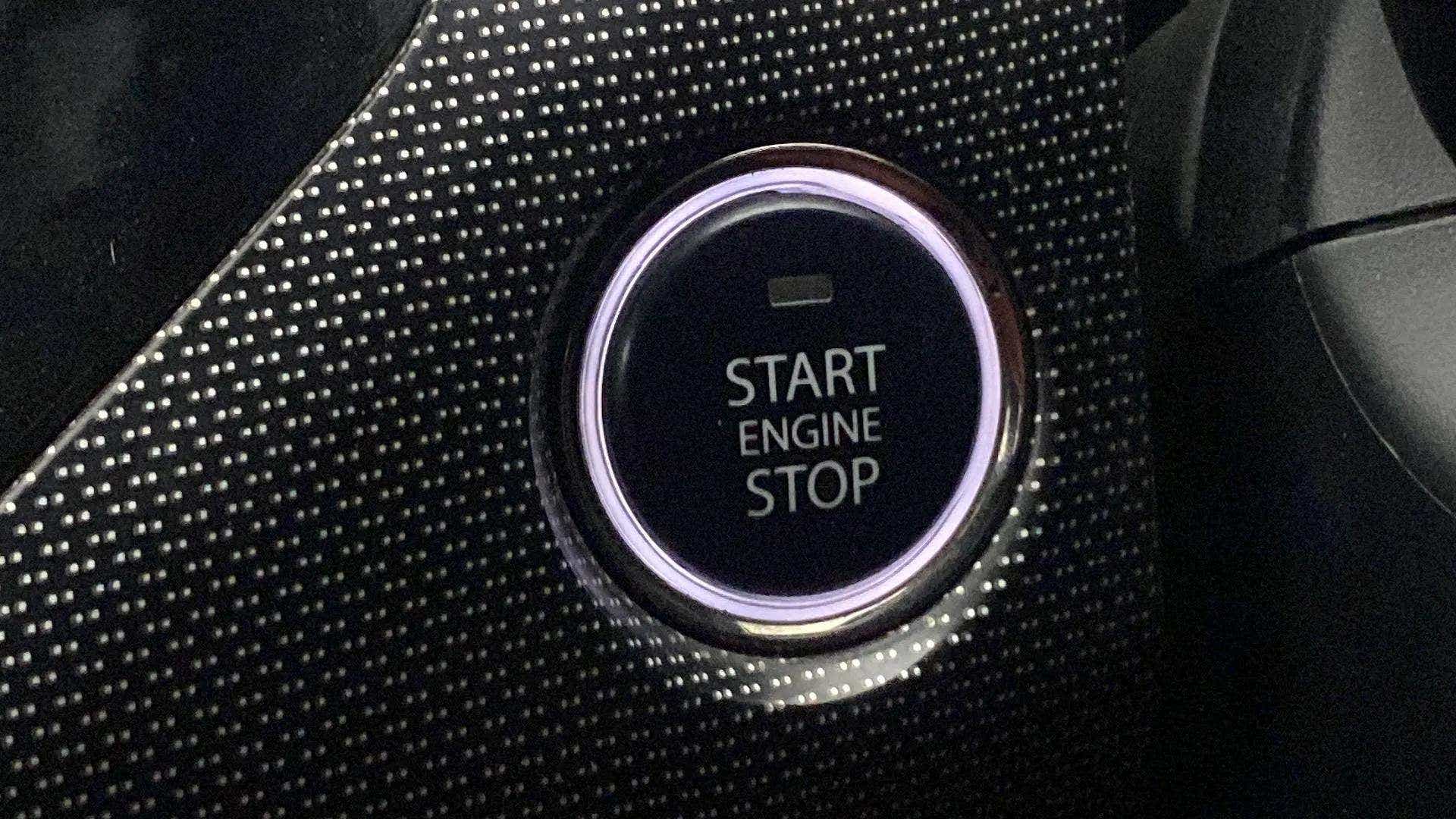 Close-up of start engine stop button of a Tata Nexon 2017-2023
