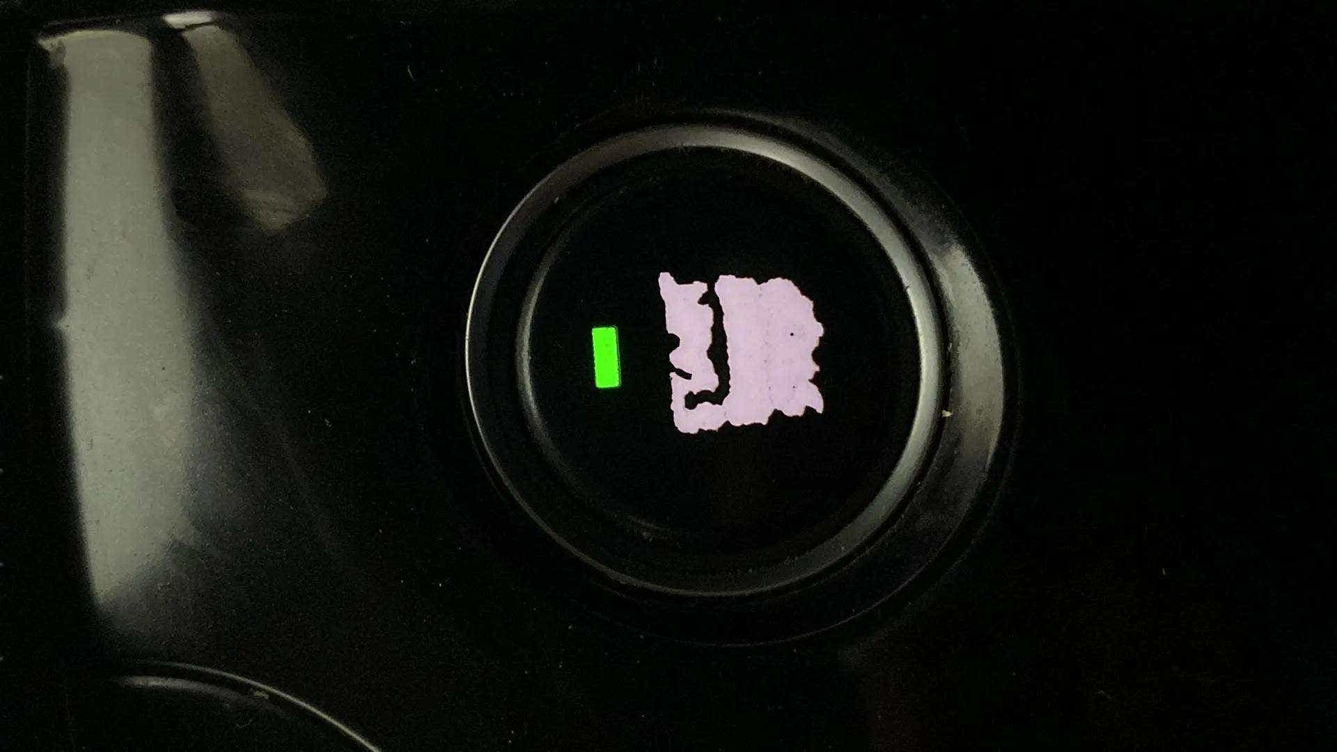 Close-up of a push start button of a Tata Nexon 2017-2023