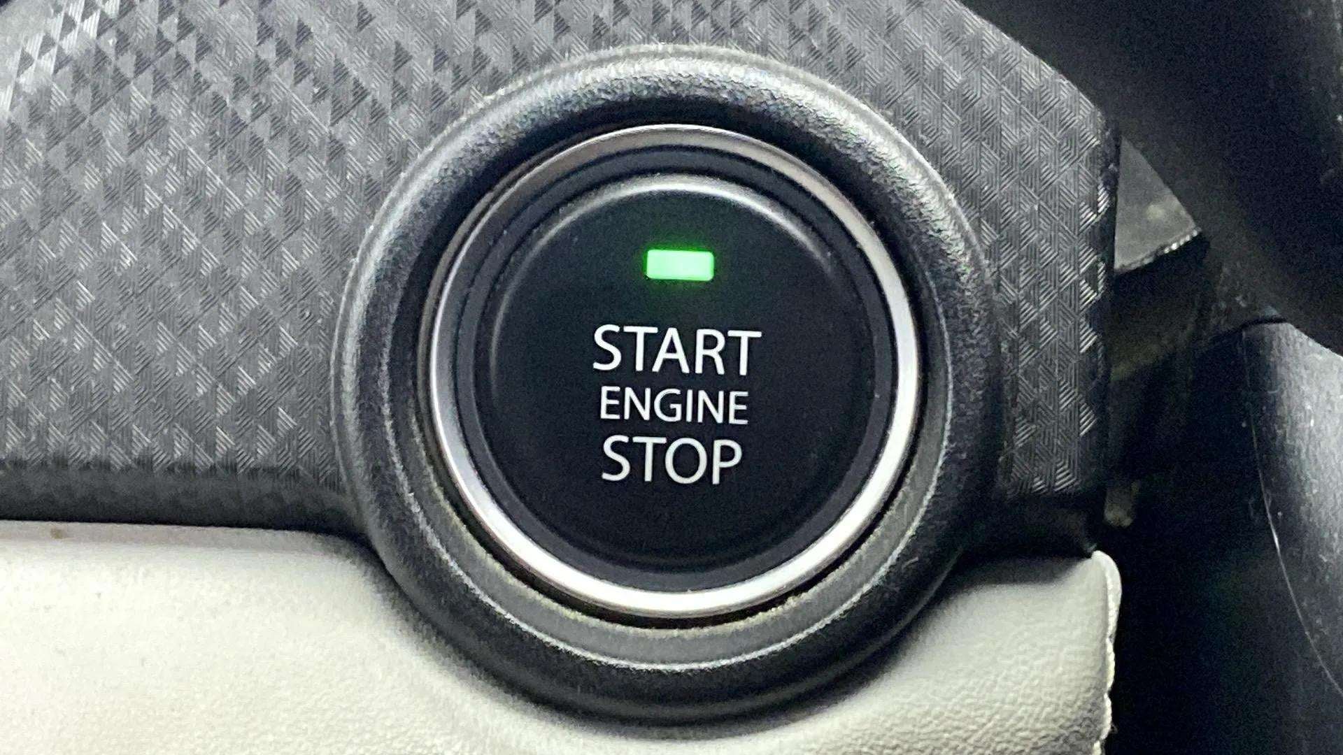 Close-up of a Tata Nexon start engine stop button