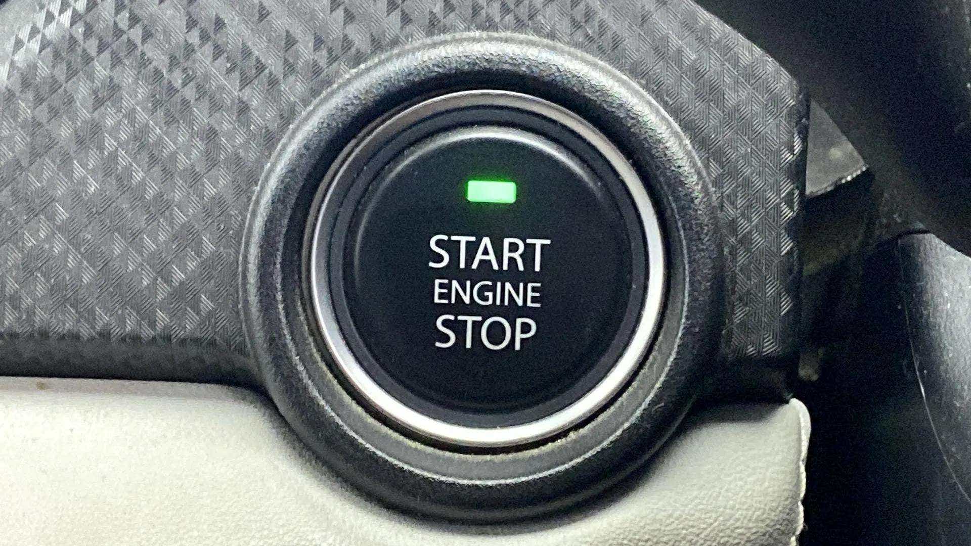 Close-up of a Tata Nexon start engine stop button