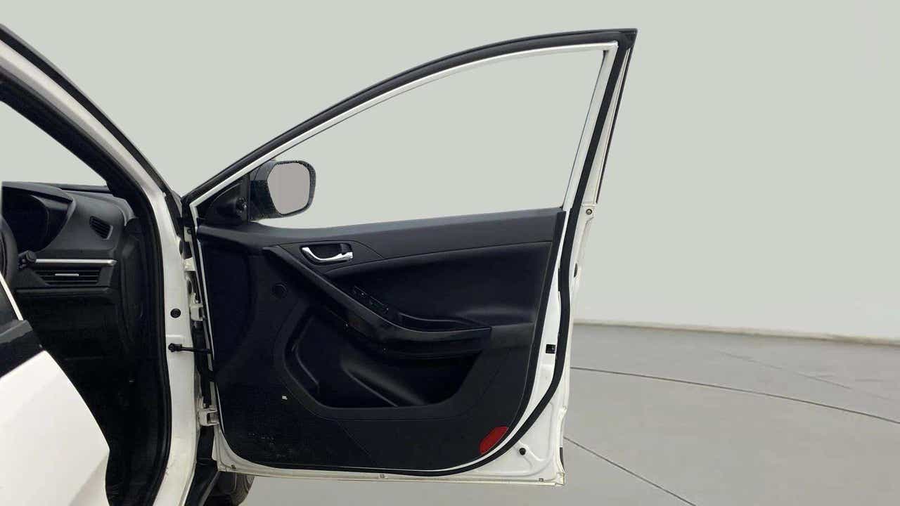 Front driver door open view of a Tata Nexon