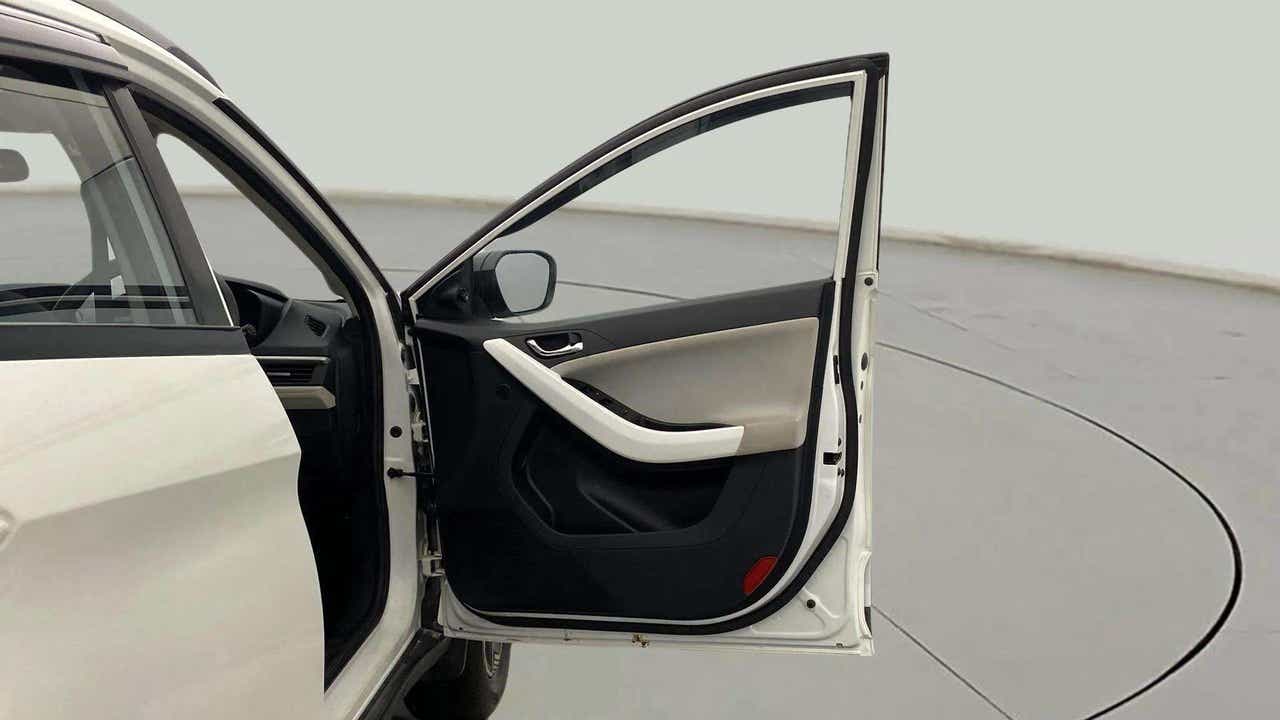 Front driver-side door and interior panel of a Tata Nexon