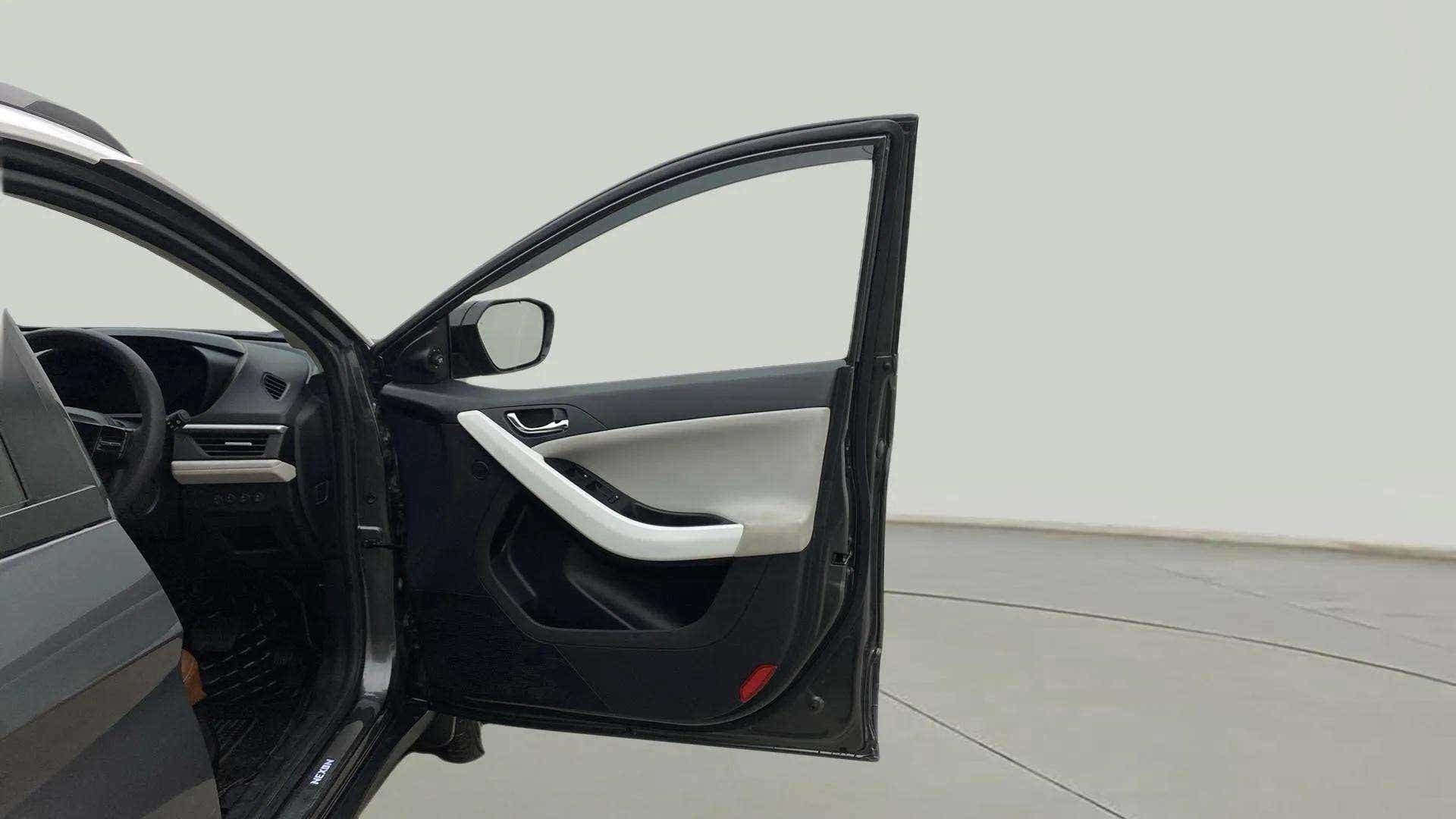 Driver side door panel and partial dashboard of a Tata Nexon