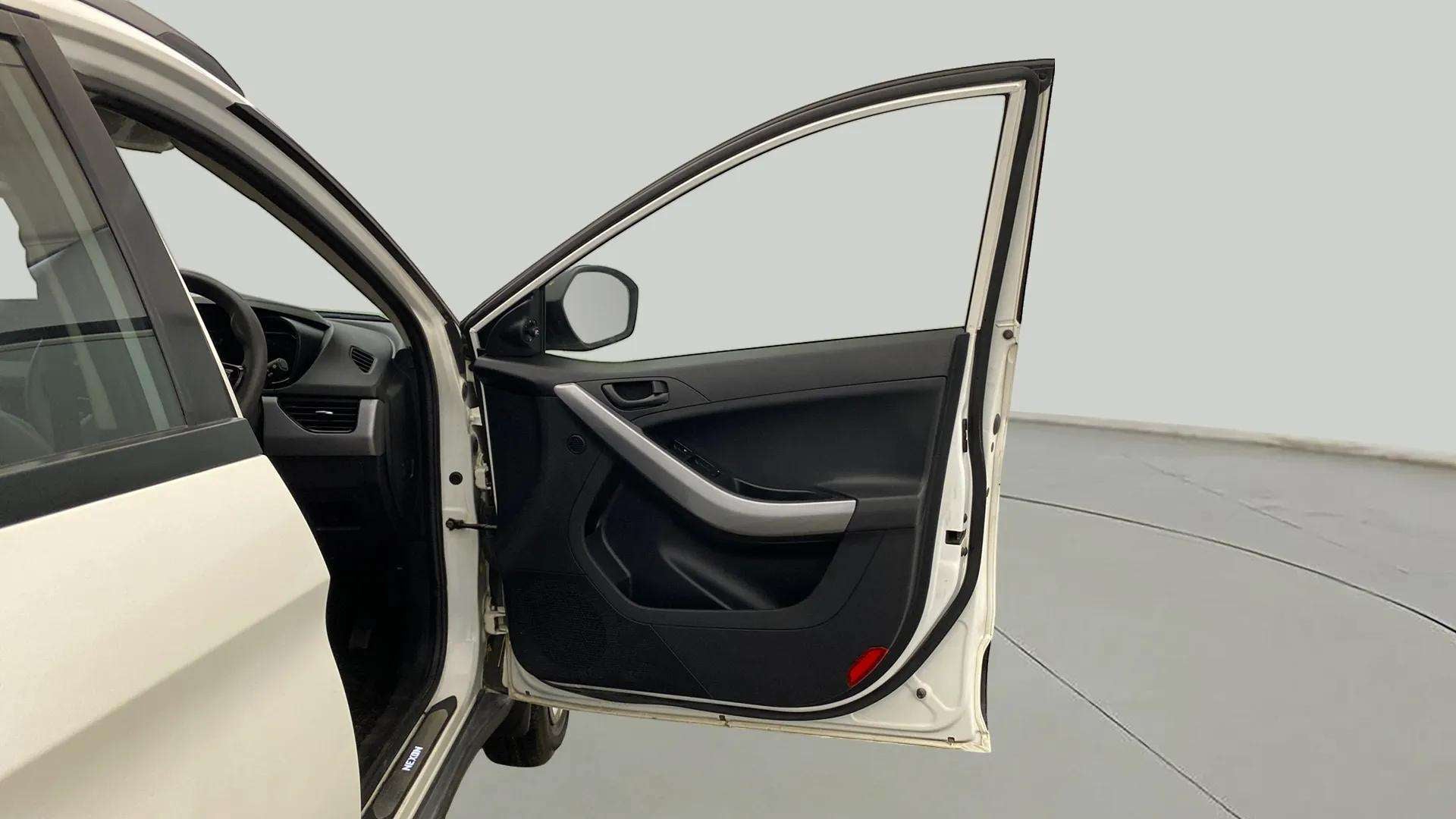 Driver side door and dashboard of a Tata Nexon 2017-2023