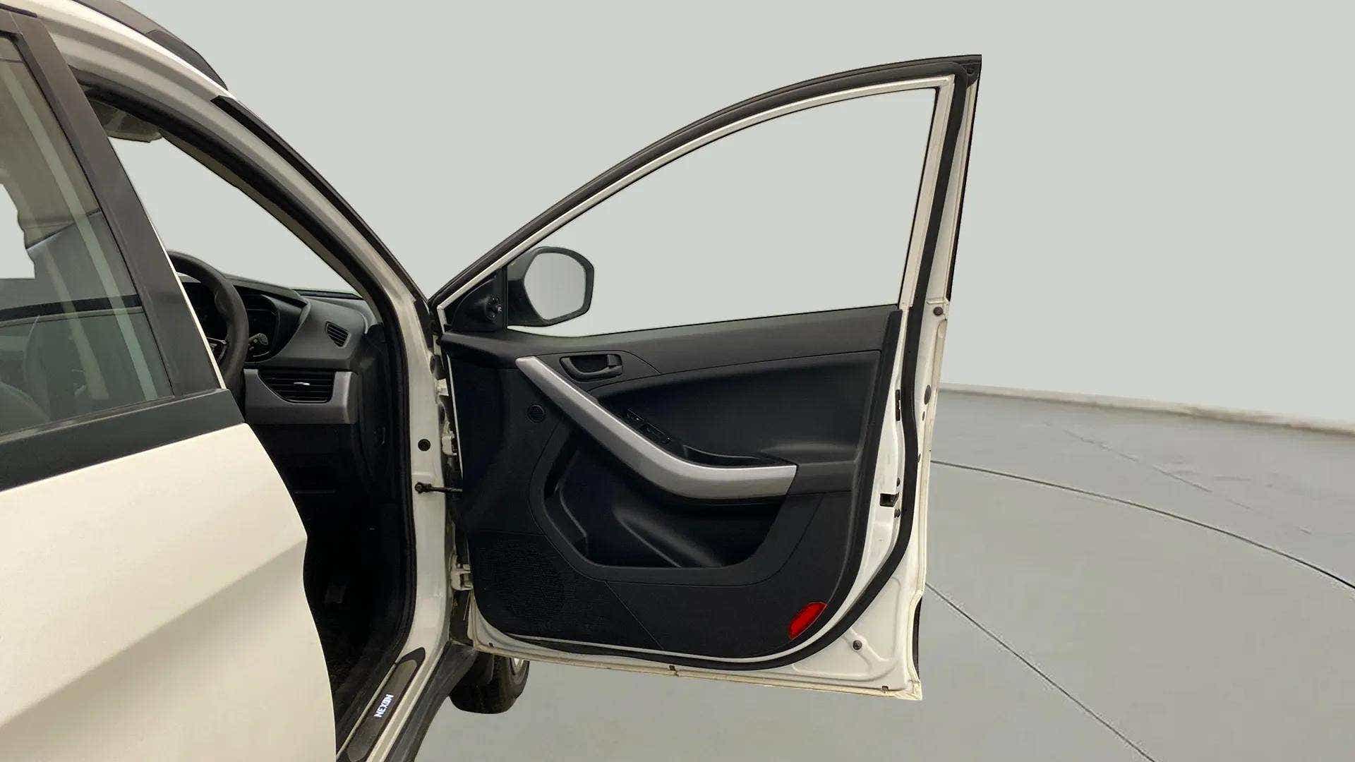 Driver side door and dashboard of a Tata Nexon 2017-2023