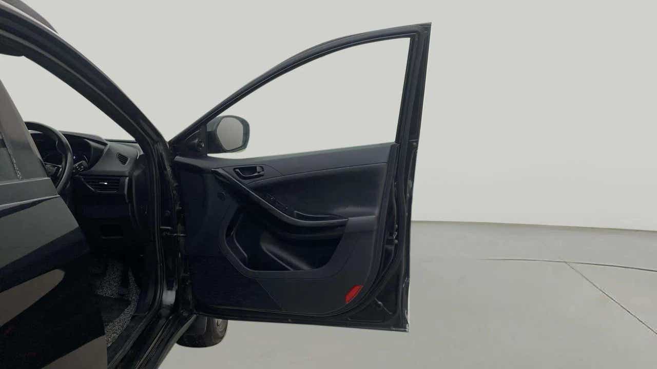 Front driver side door and partial dashboard of a Tata Nexon 2017-2023