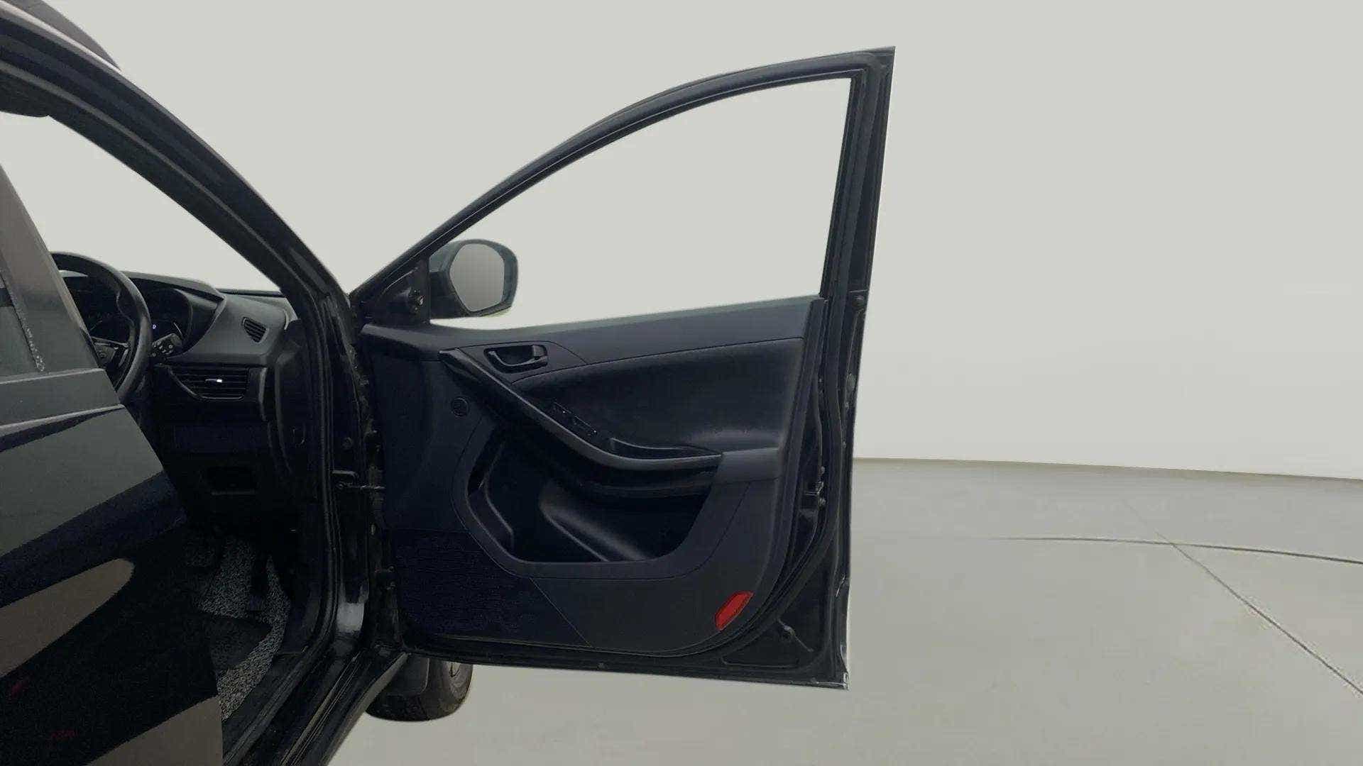 Front driver side door and partial dashboard of a Tata Nexon 2017-2023