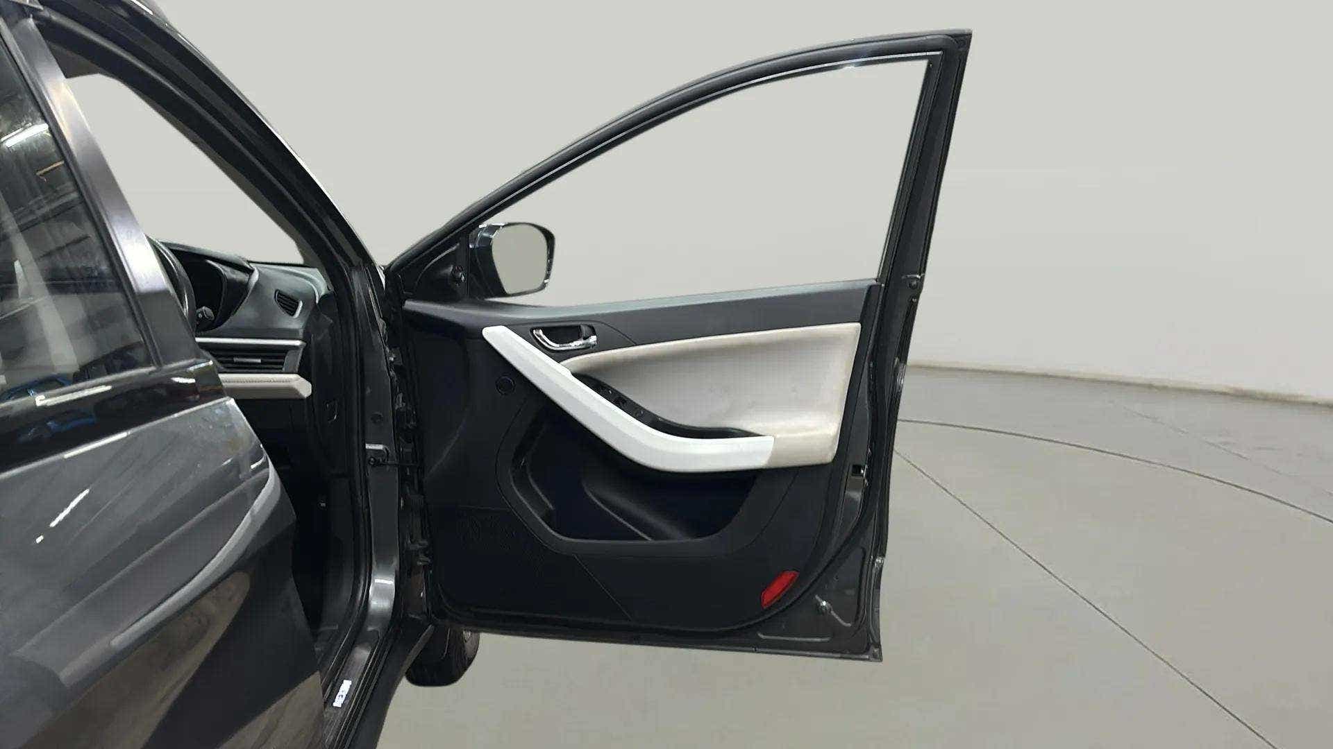 Front driver side door interior of a Tata Nexon