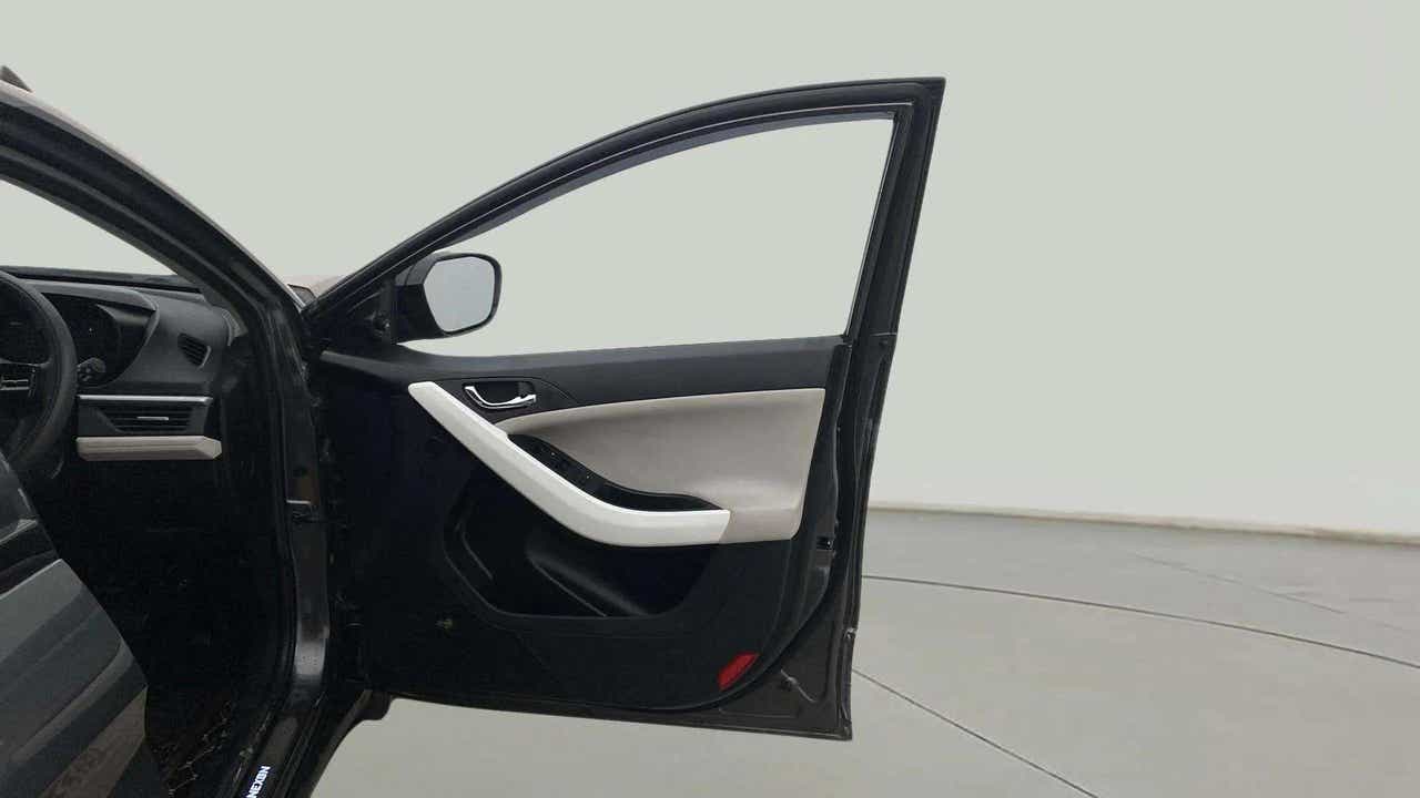 Front driver side door and dashboard of a Tata Nexon