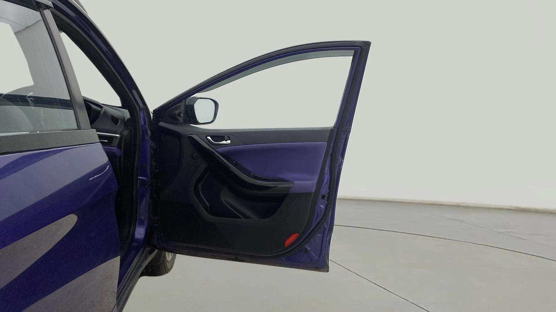 Front driver-side door view of a Tata Nexon