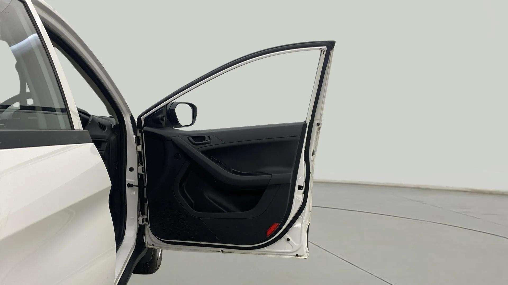 Front driver-side door open view of a Tata Nexon