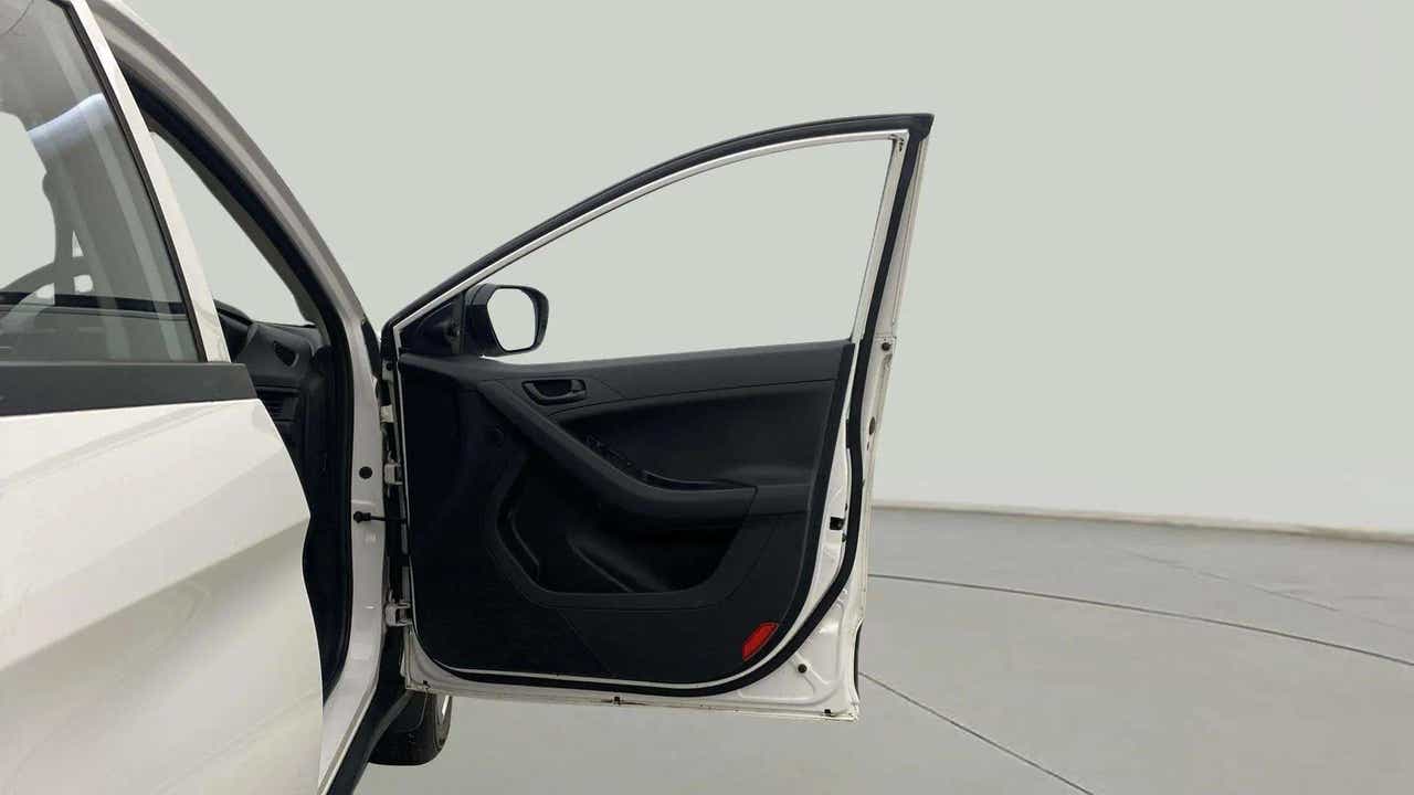 Front driver-side door open view of a Tata Nexon