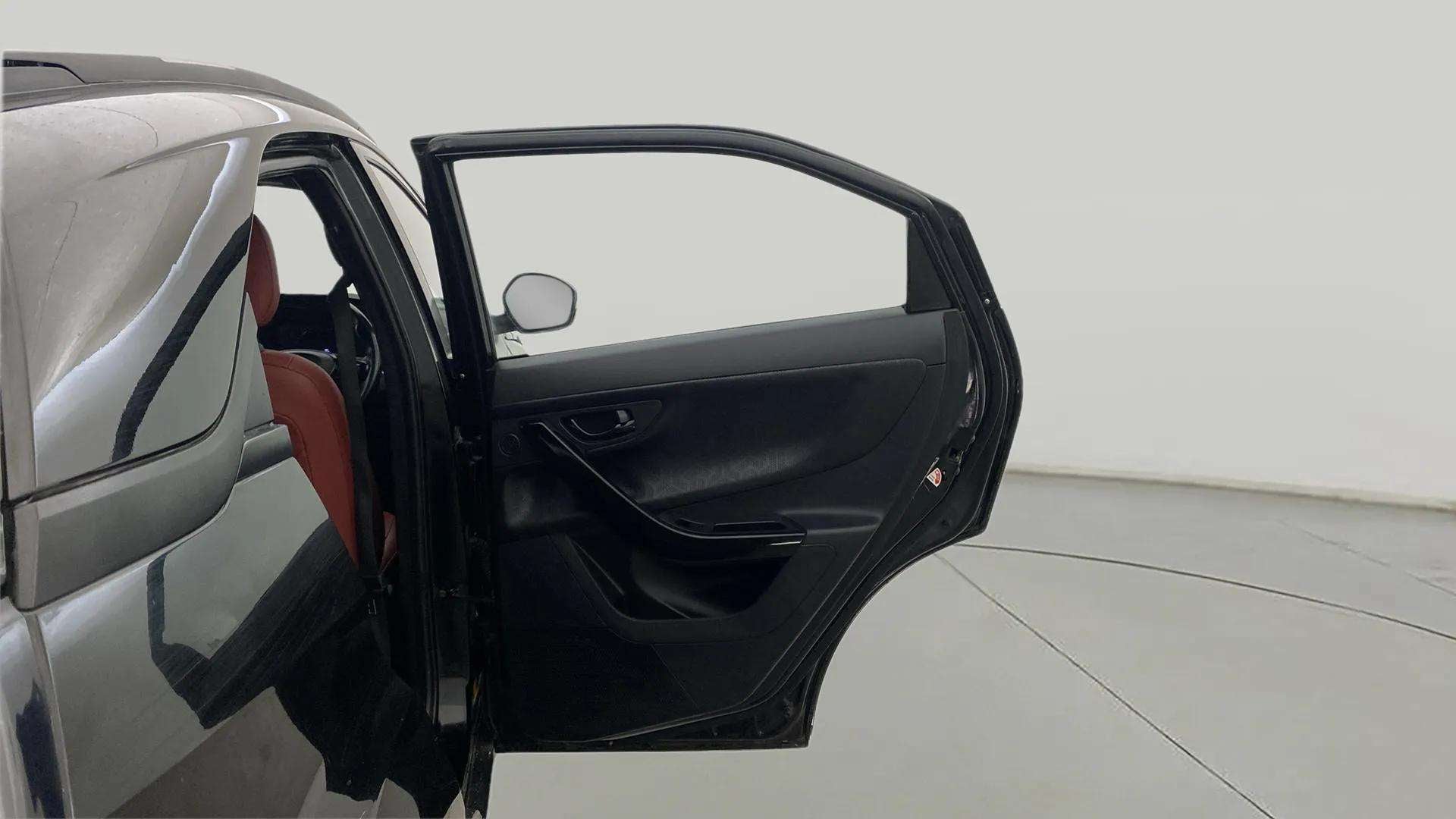 Left rear door open view of a Tata Nexon 2017-2023