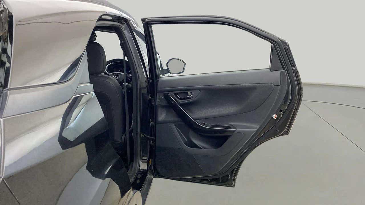 Open rear door and partial interior view of a Tata Nexon 2017-2023