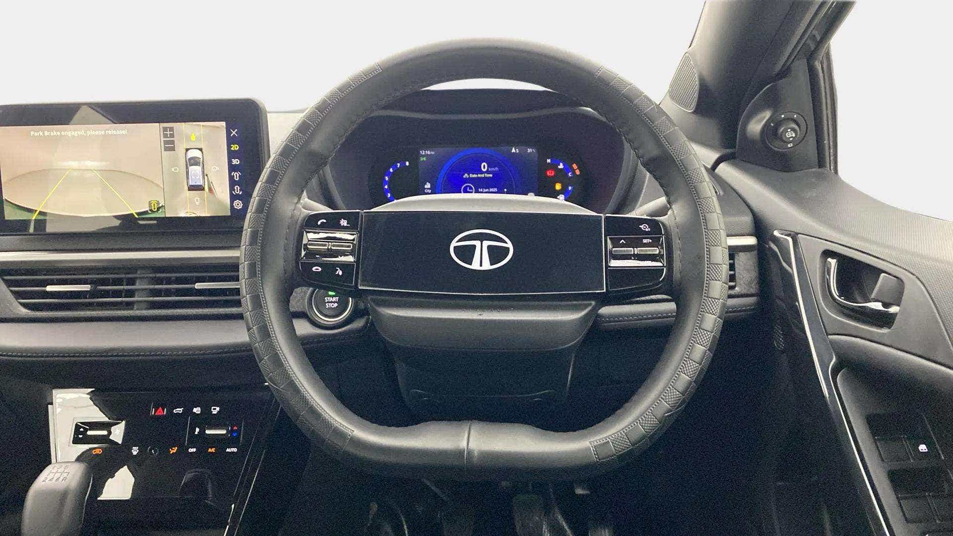 Interior dashboard and steering wheel of a Tata Nexon