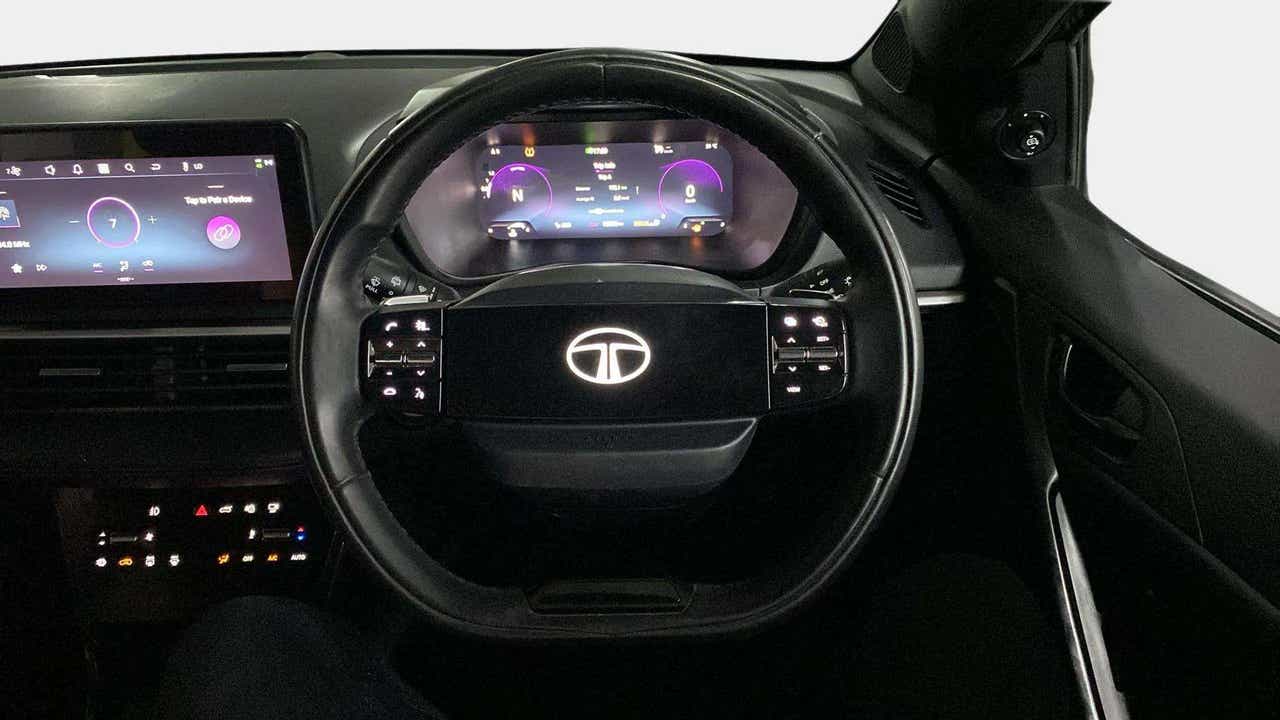 Steering wheel and dashboard view of a Tata Nexon
