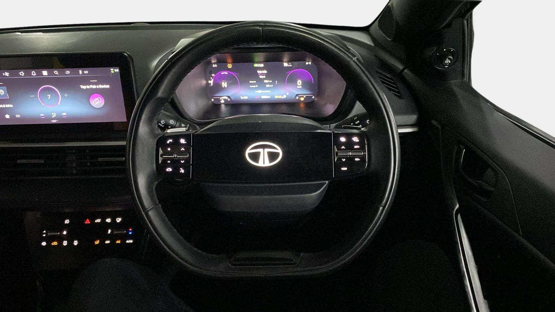 Steering wheel and dashboard view of a Tata Nexon