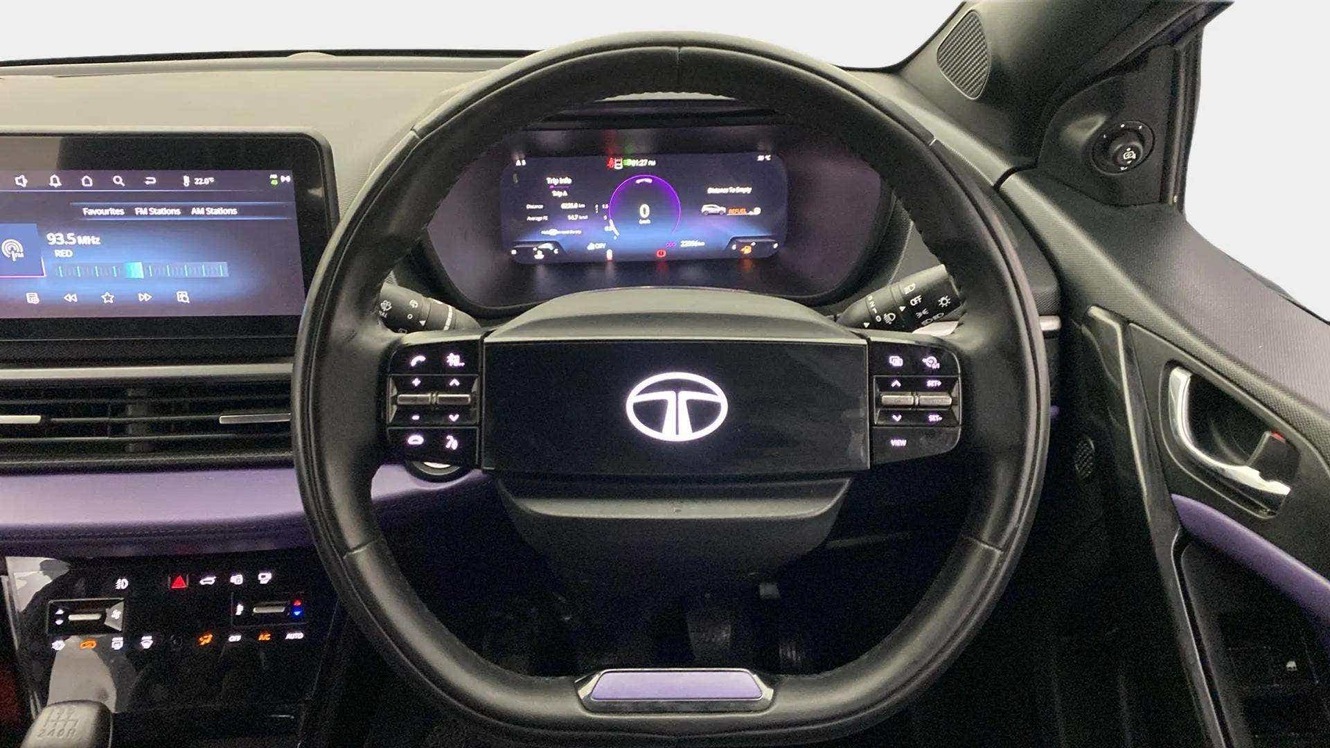 Dashboard and steering wheel view of a Tata Nexon 2017-2023