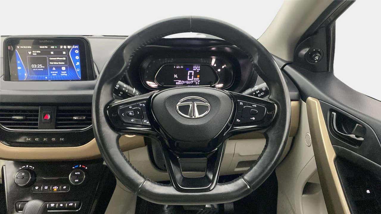 Interior dashboard and steering wheel of a Tata Nexon 2017-2023
