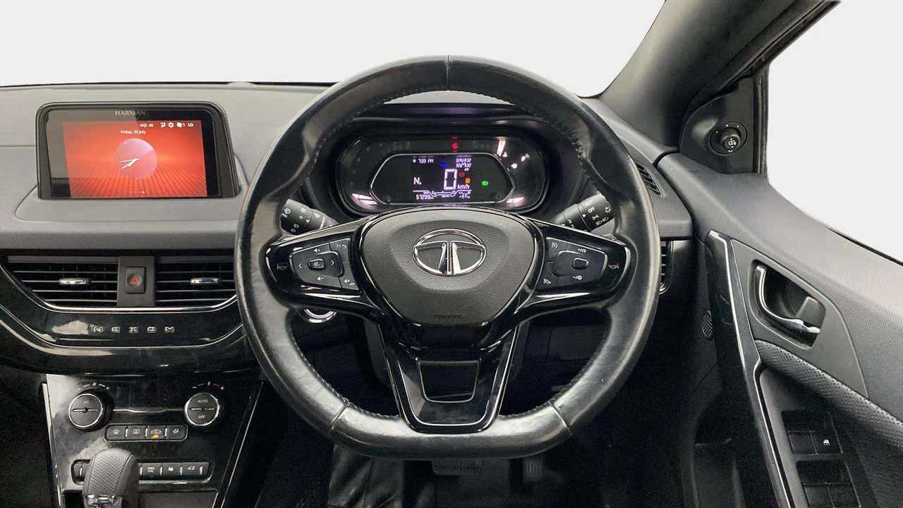 Dashboard and steering wheel view of a Tata Nexon 2017-2023