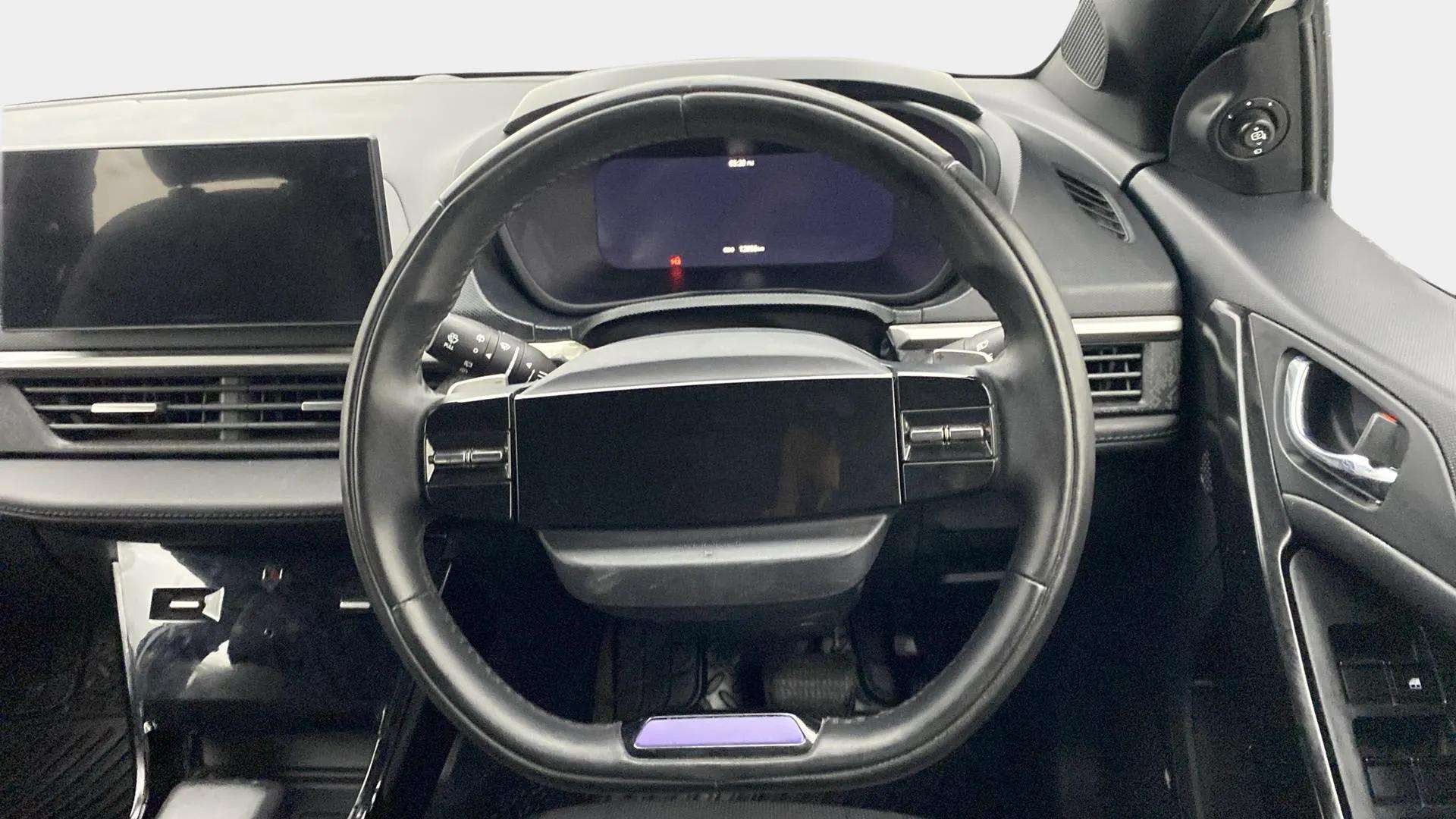 Steering wheel and dashboard view of a Tata Nexon
