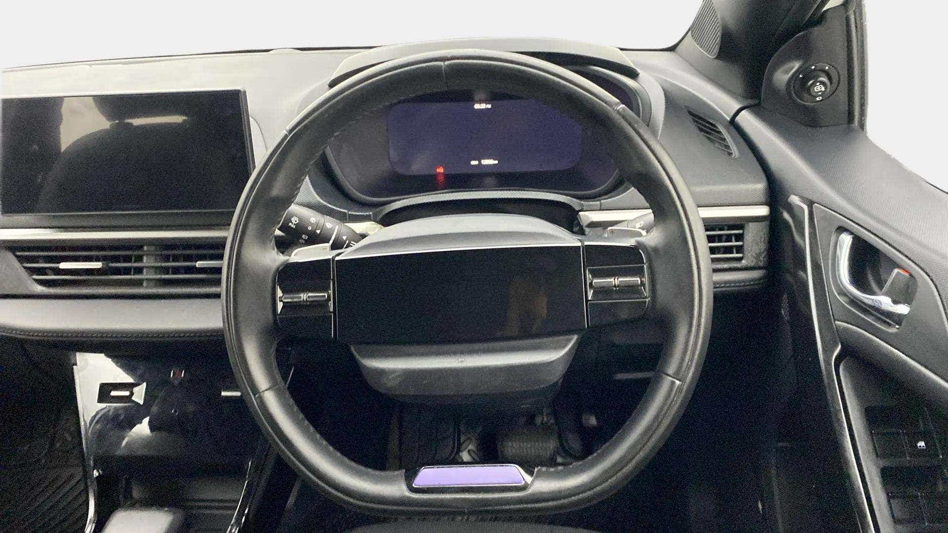 Steering wheel and dashboard view of a Tata Nexon