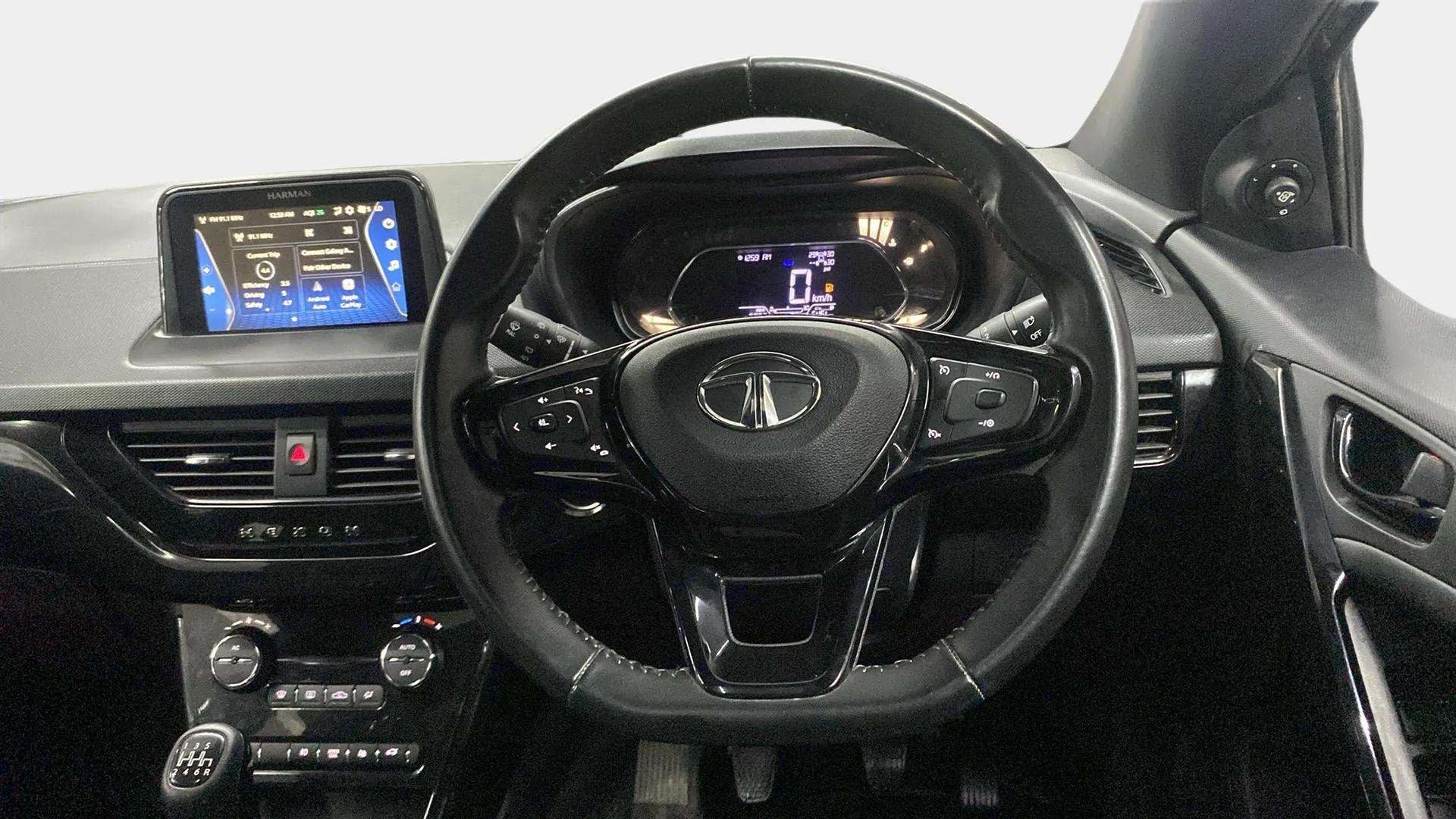 Interior dashboard and steering wheel of a Tata Nexon 2017-2023