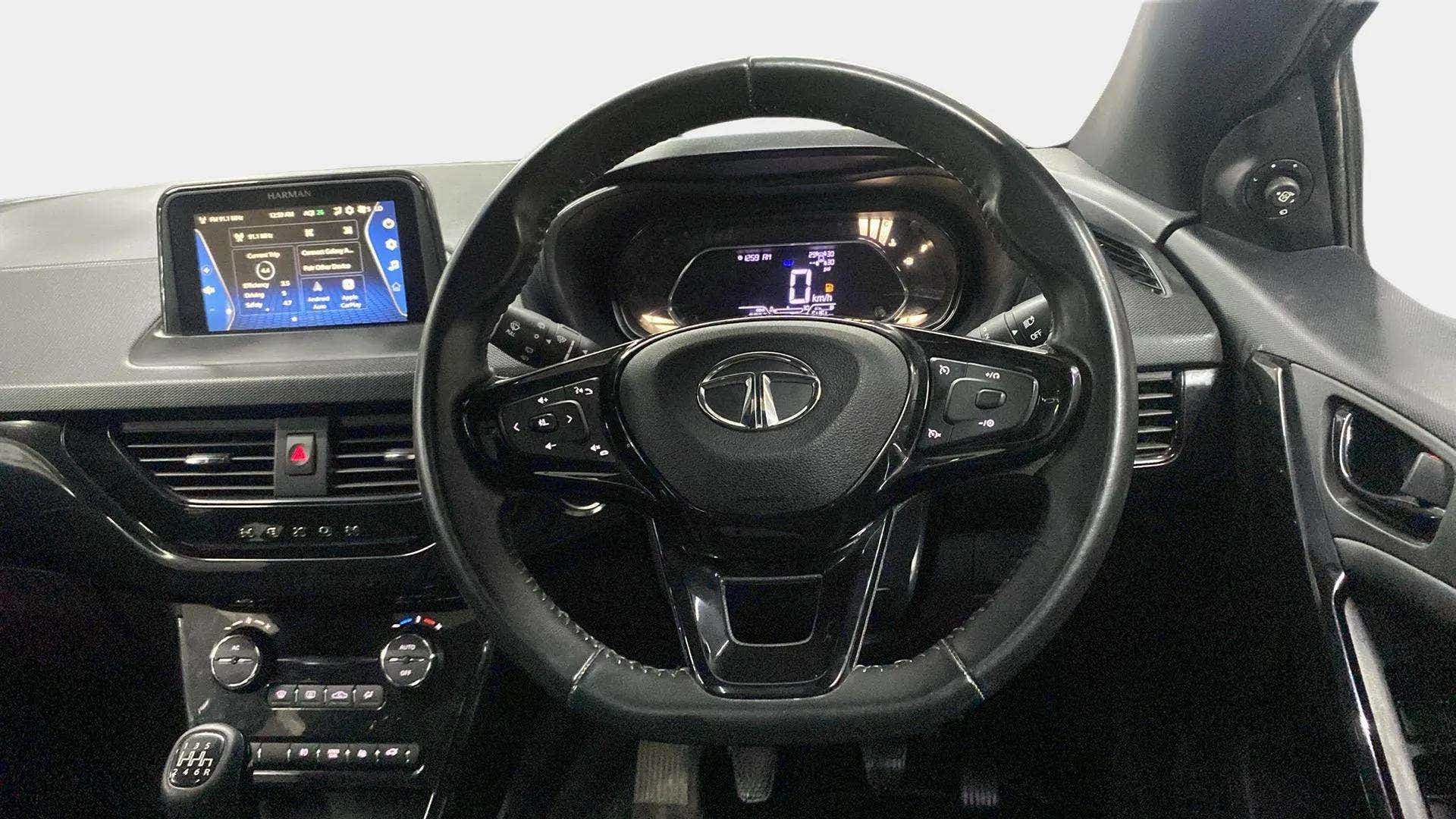 Interior dashboard and steering wheel of a Tata Nexon 2017-2023